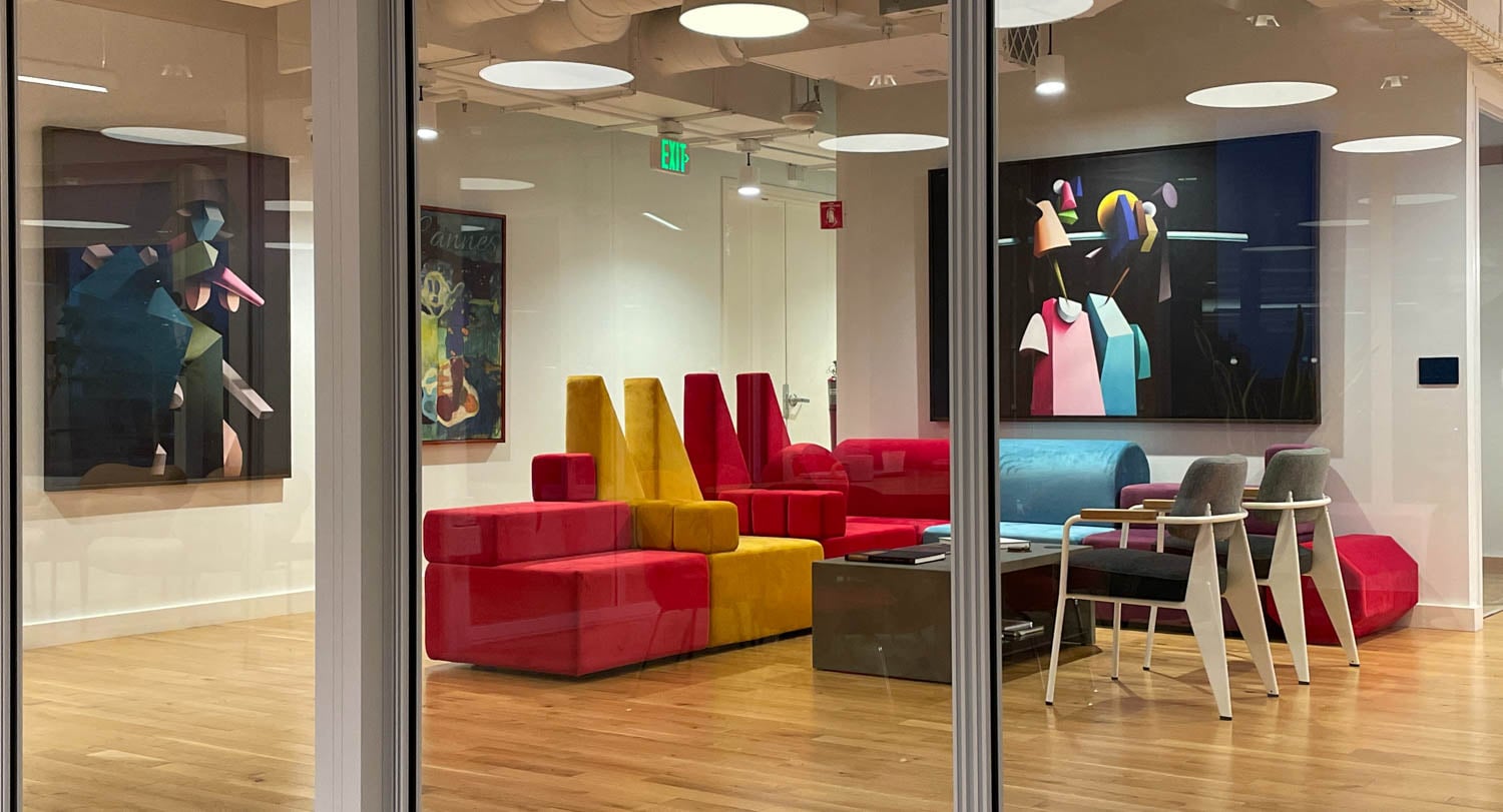 ad agency with red and yellow sofa