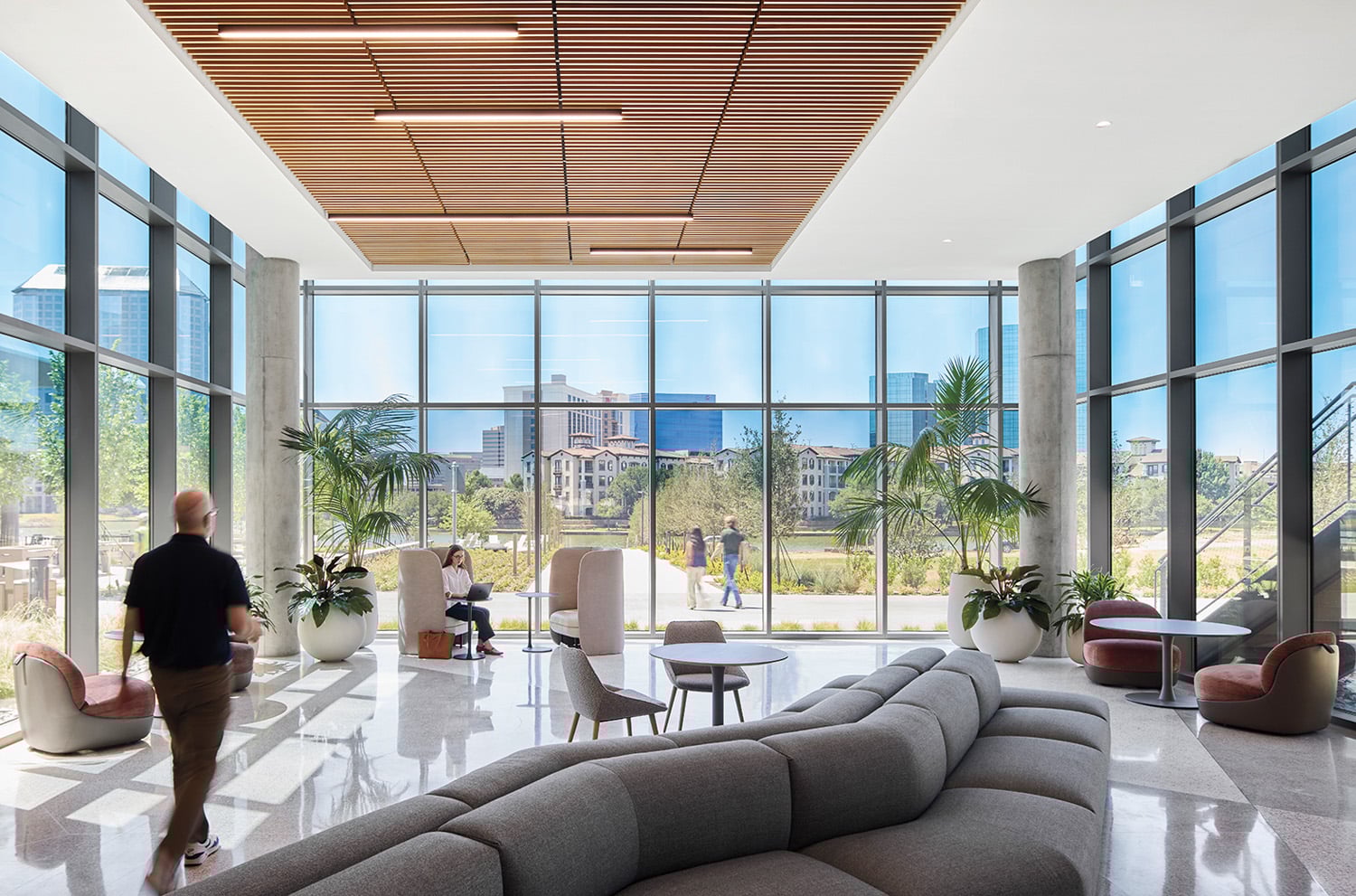 wall of windows near gray sectional