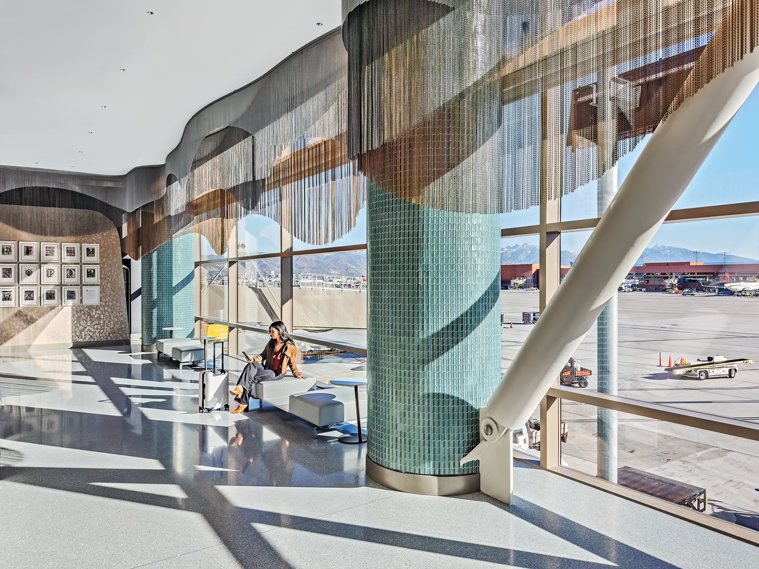 Aluminum chains shimmer by the windows in the arrival space, which is meant to evoke snowy Park City winters