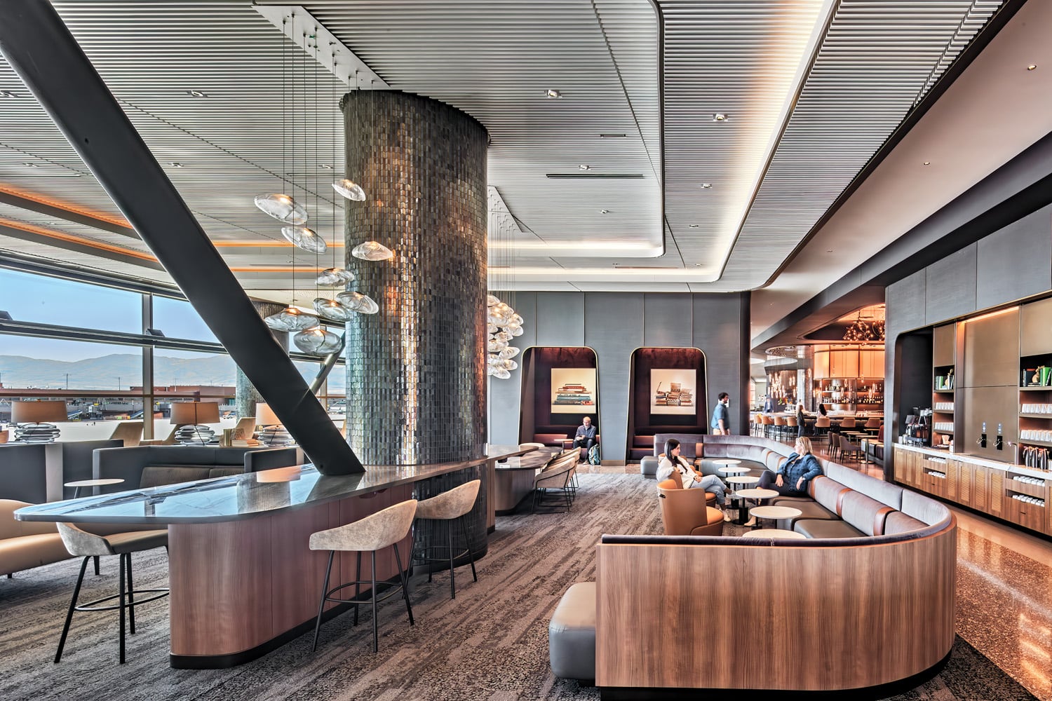 a glass tile–clad column in the bar area