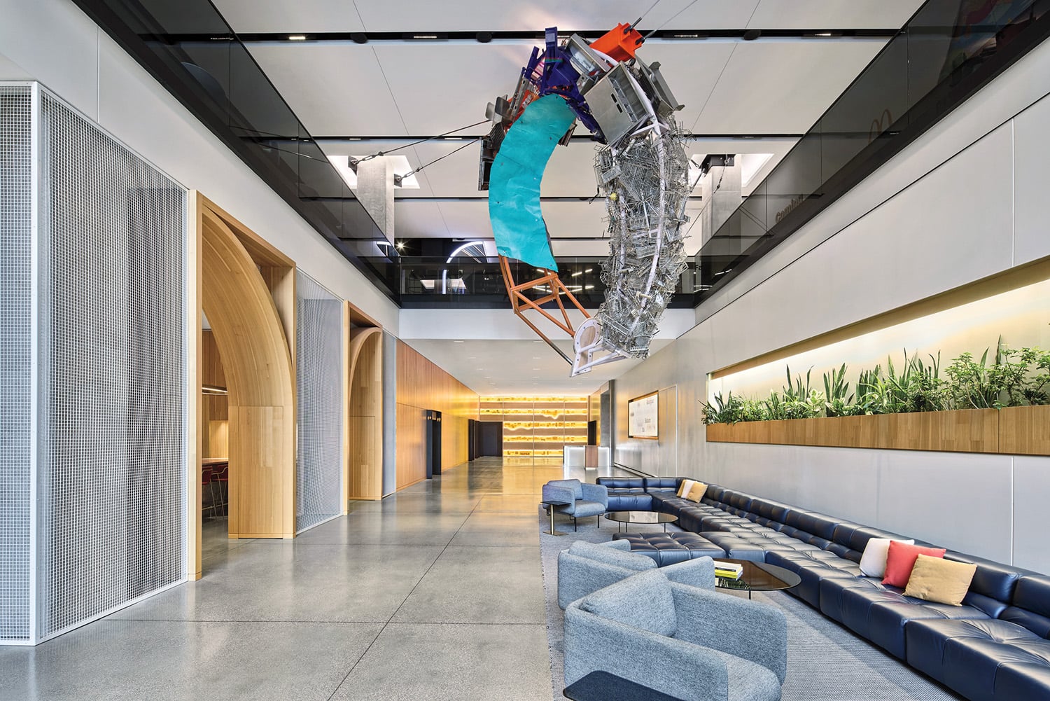 site-specific sculpture—an assemblage of cooking implements patented by McDonald’s employees—still suspended overhead.