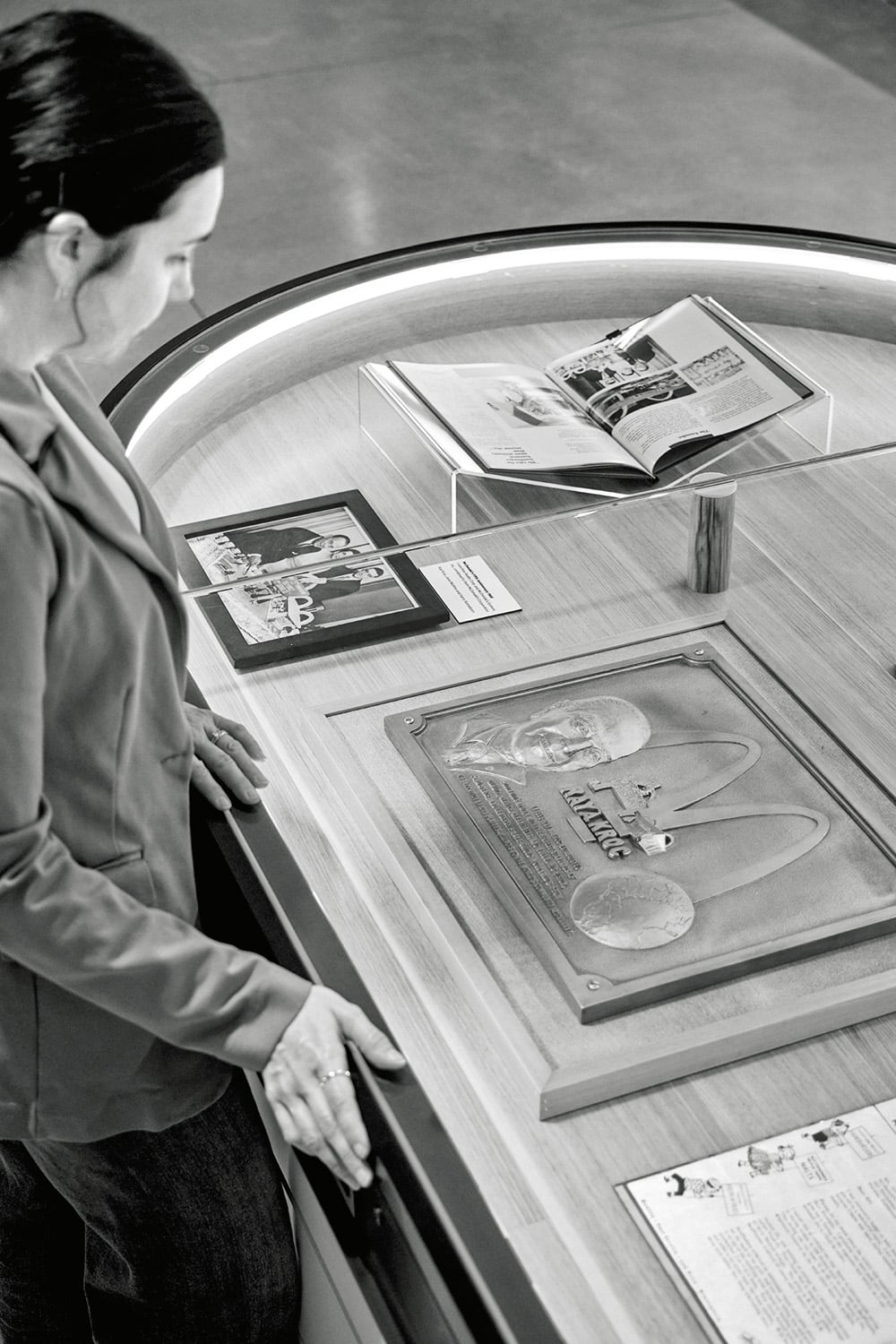 A 20‑foot‑long vitrine anchors the heritage exhibit area.