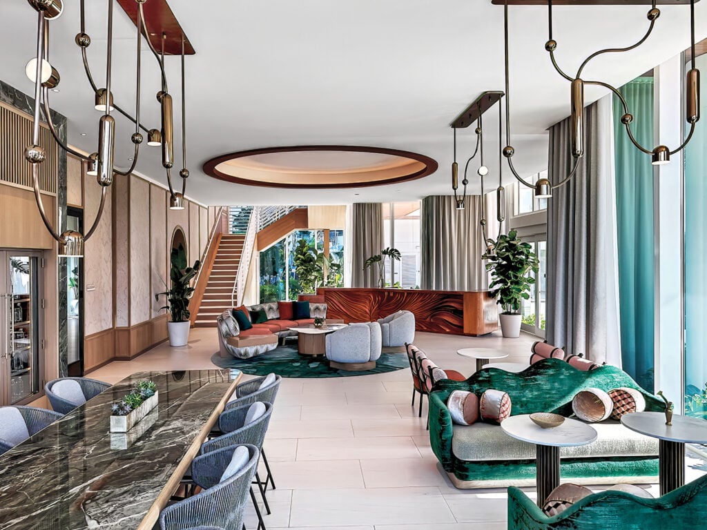 suite with dining table and staircase and lounge area