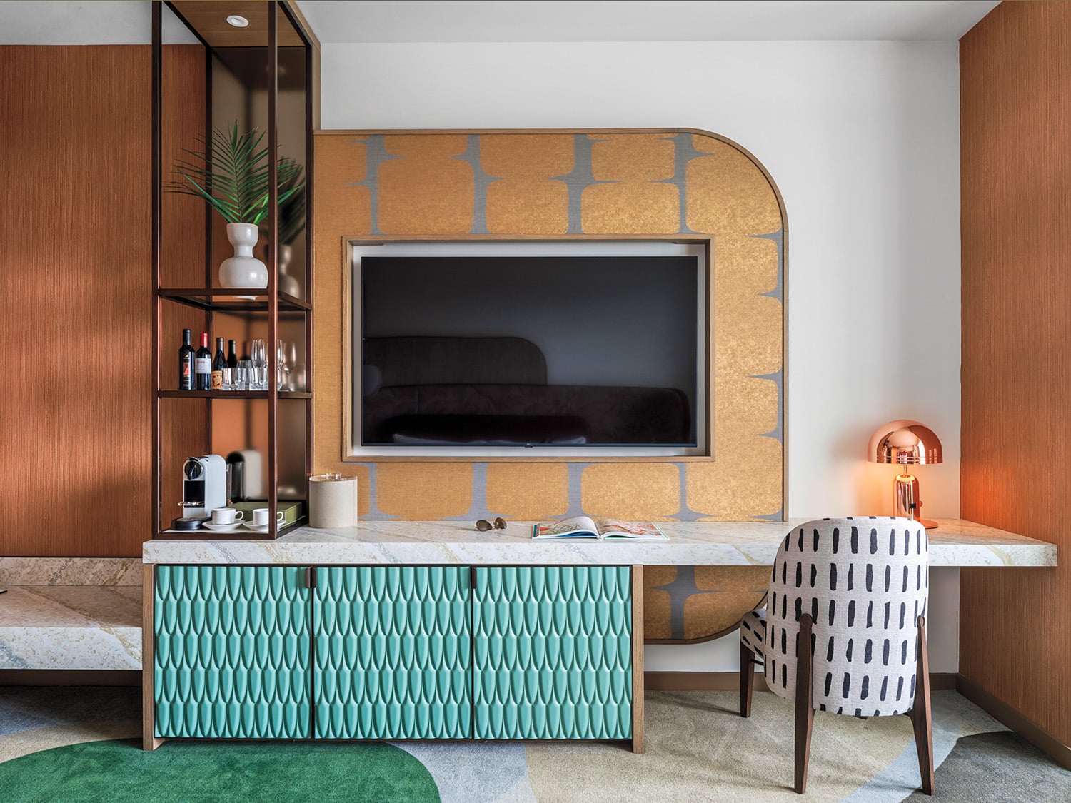 guest room with green desk and wood wall detail