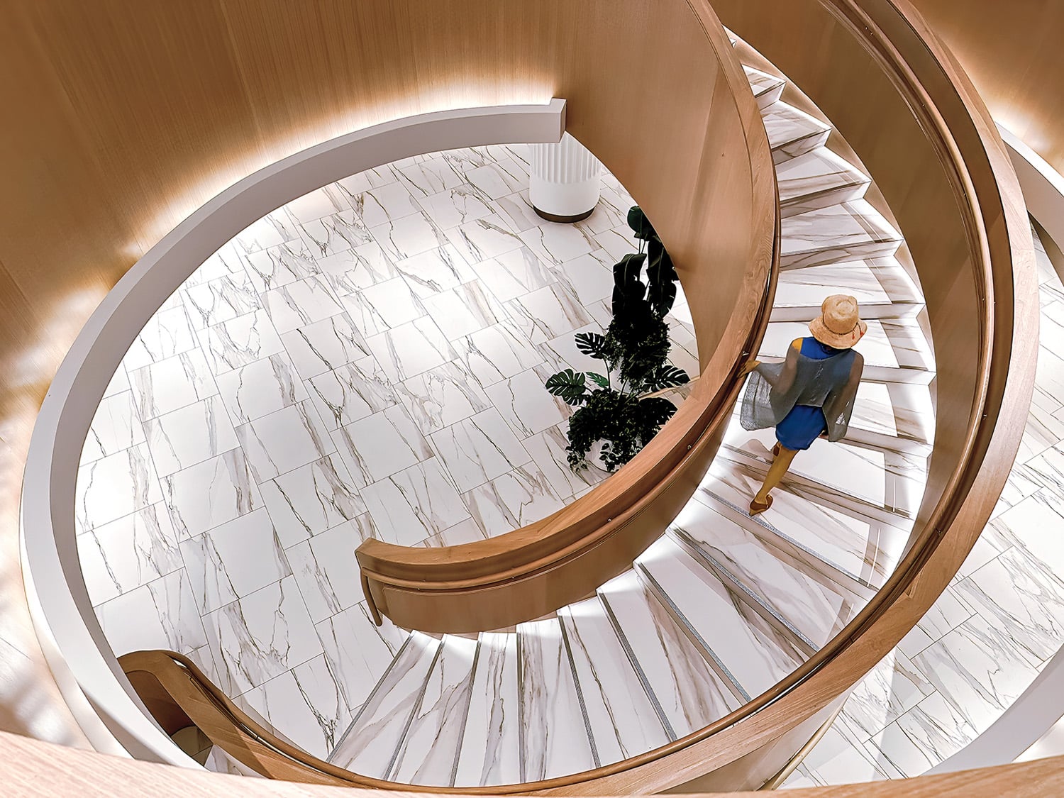 grand staircase flanked by wood