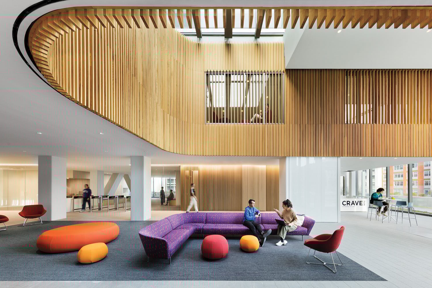 purple couches under a wood plank ceiling