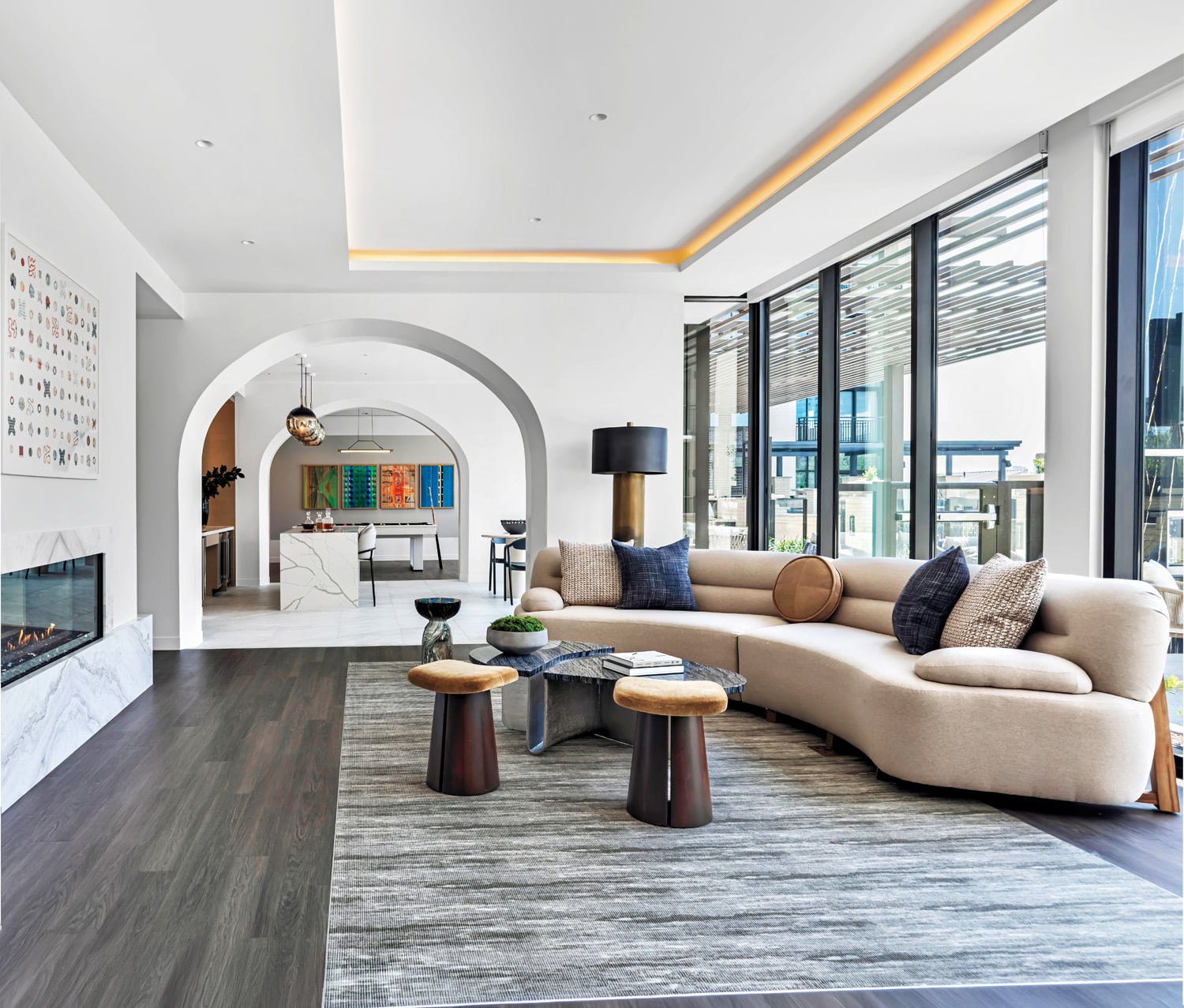 The amenity suite includes an enfilade comprising the billiard room, selfservice café with Carlo Colombo’s Glo pendants, and lounge, the latter presided over by Tina Ruyi’s Scribbles & Blobs
