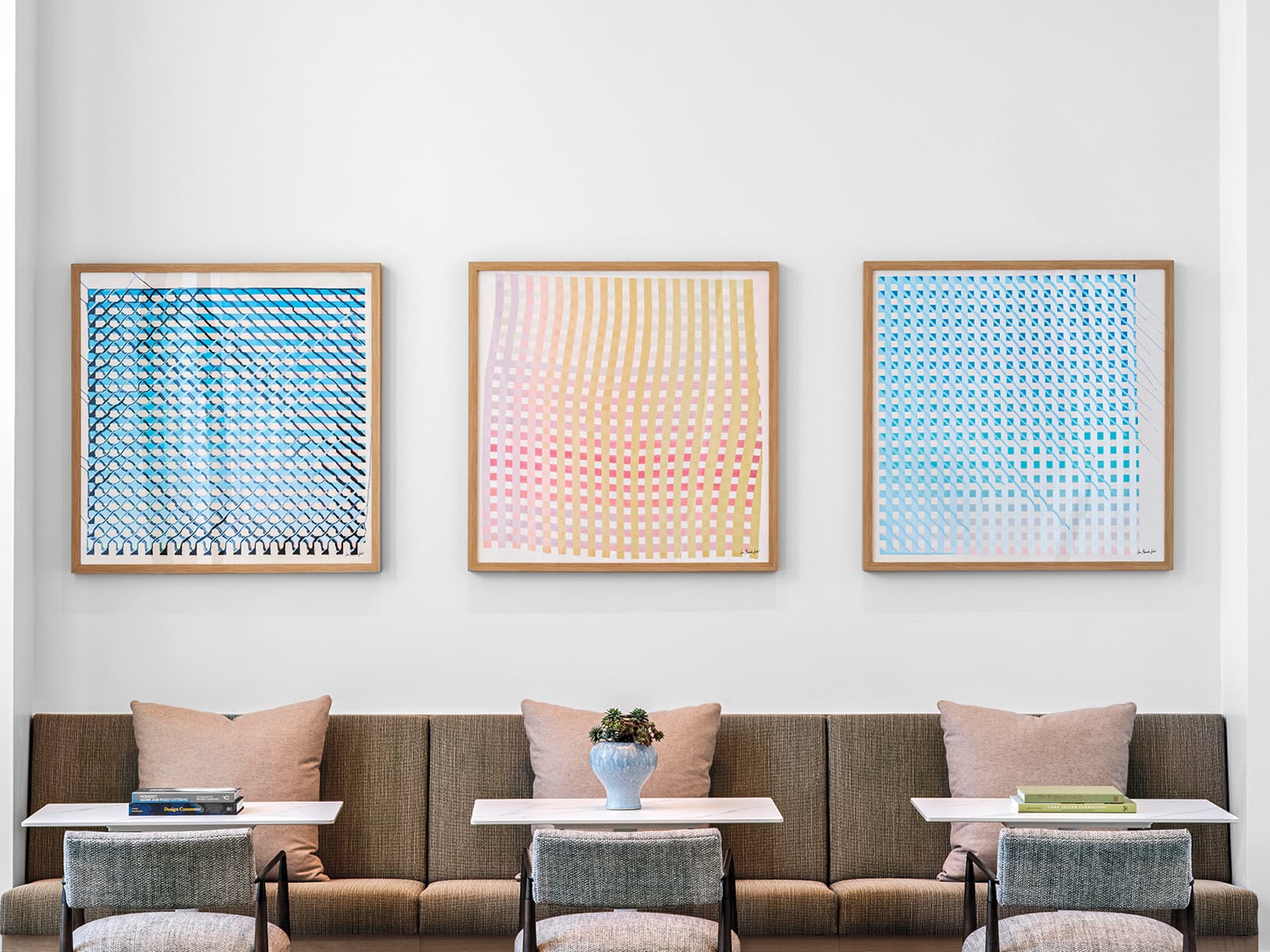 three framed artworks in pastel colors