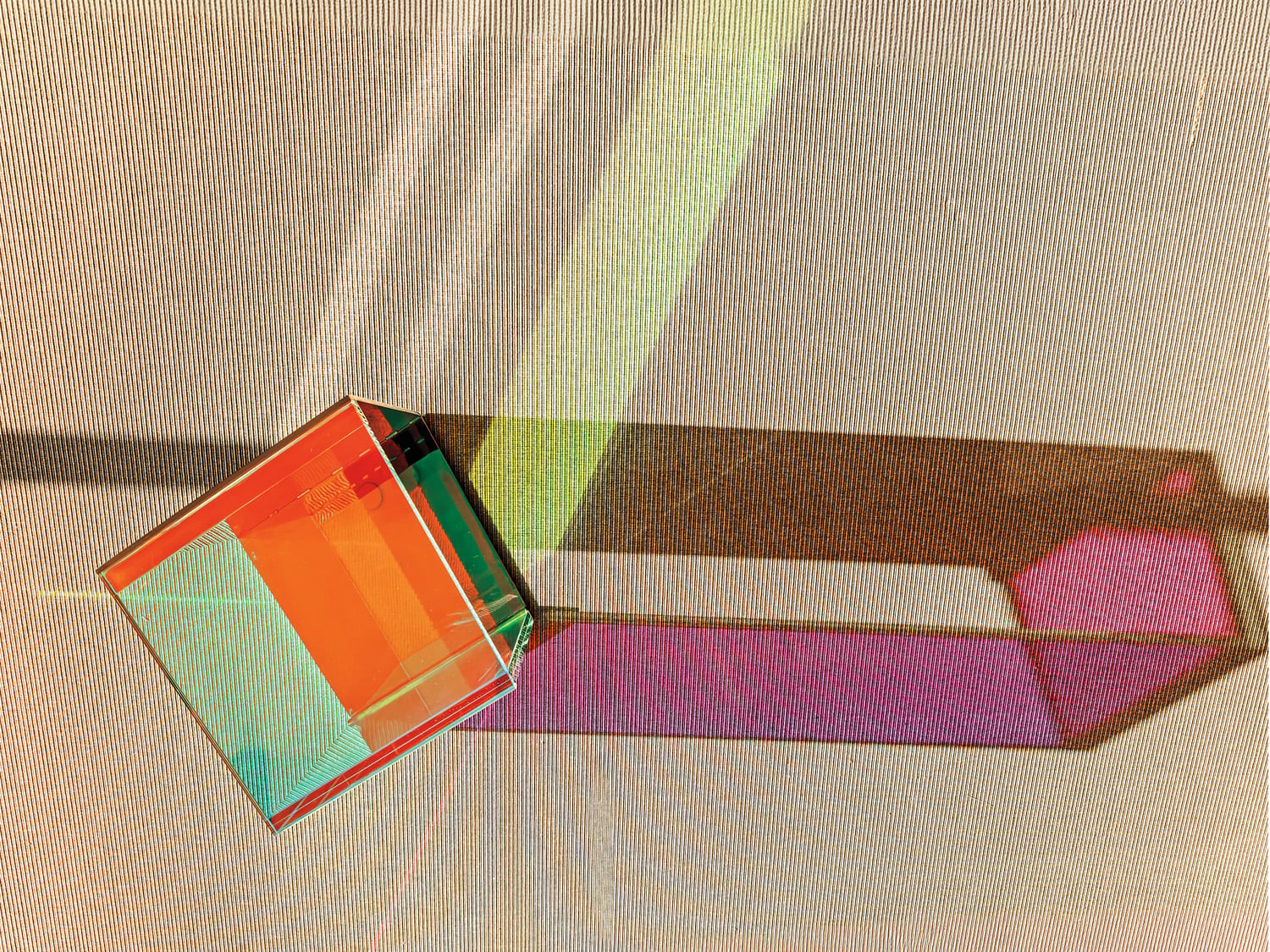 Sunlight refracts through Rottet’s prismlike Dichroic side table in coworking.