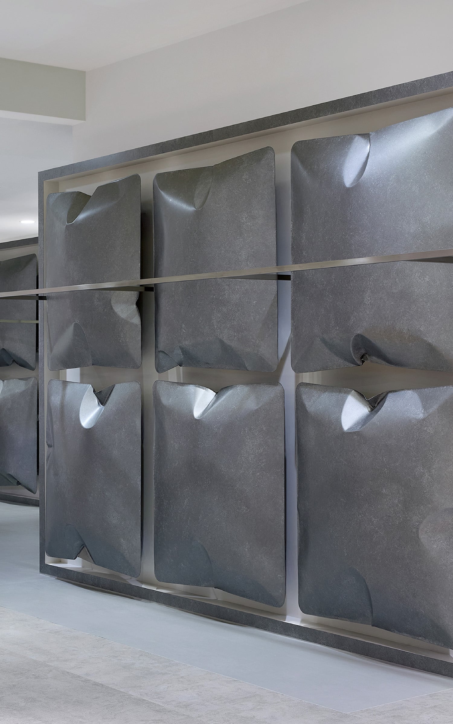 A room with a bunch of metal pieces on the wall