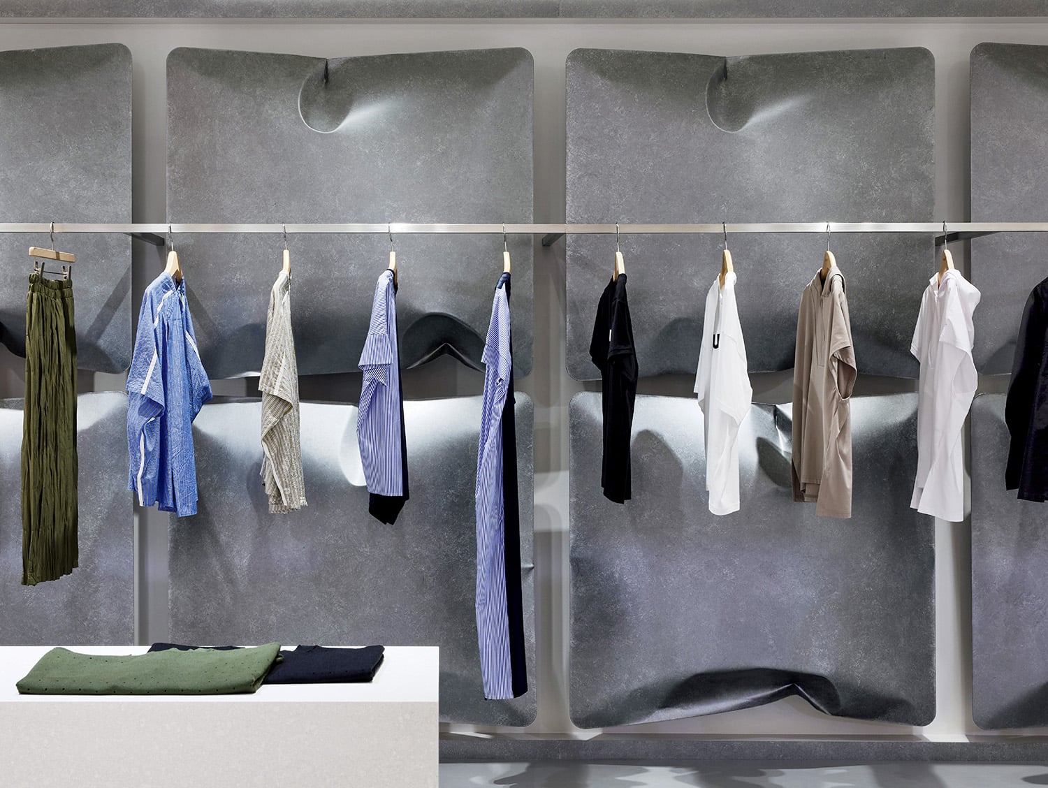 A bunch of clothes hanging on a wall