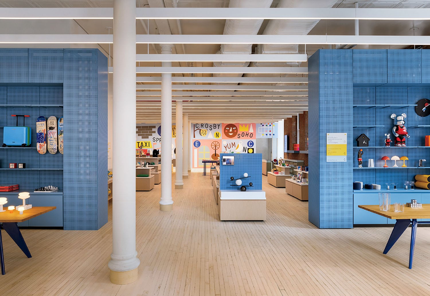 A room with a blue wall and a wooden floor.