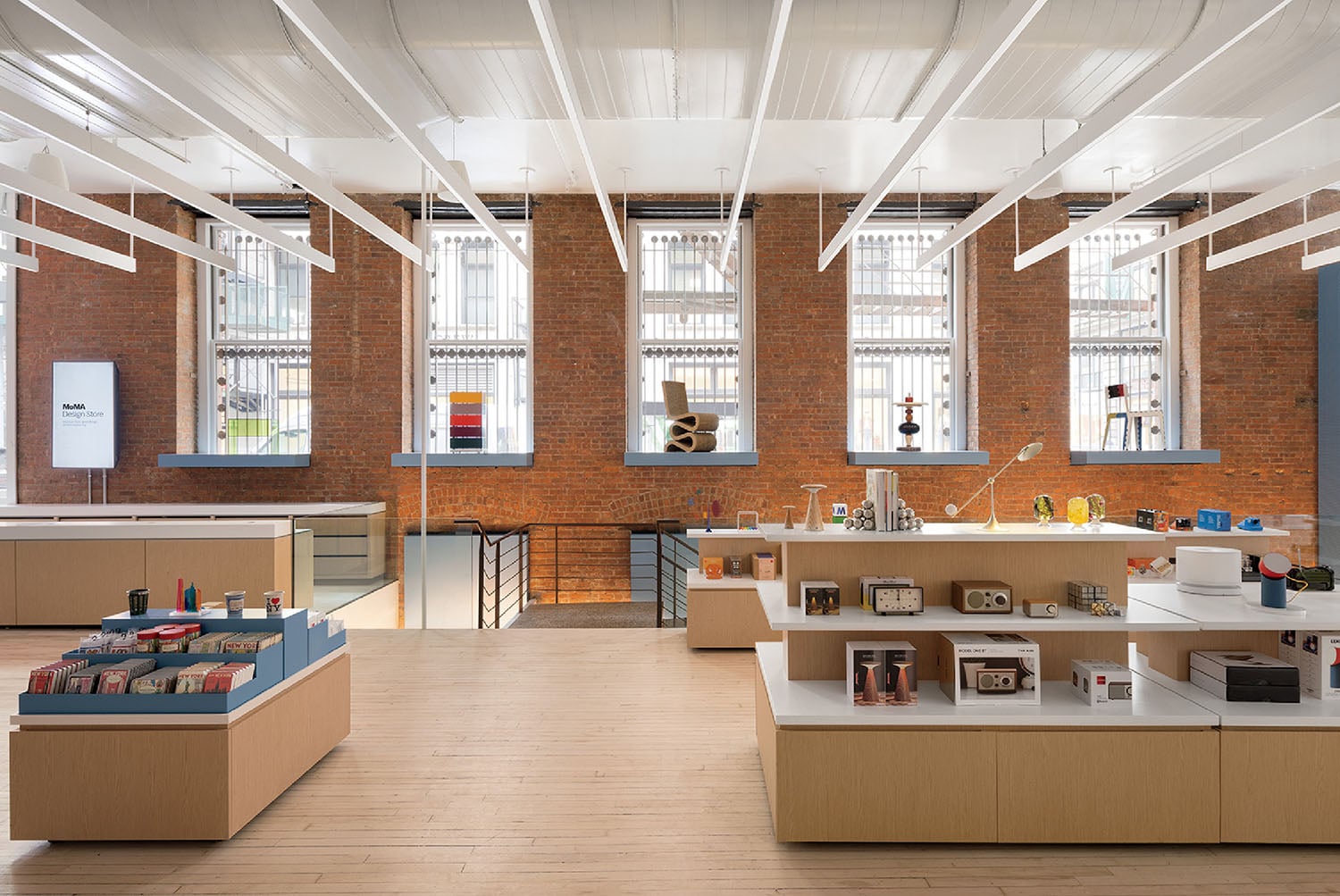 A room with a brick wall and a wooden floor.