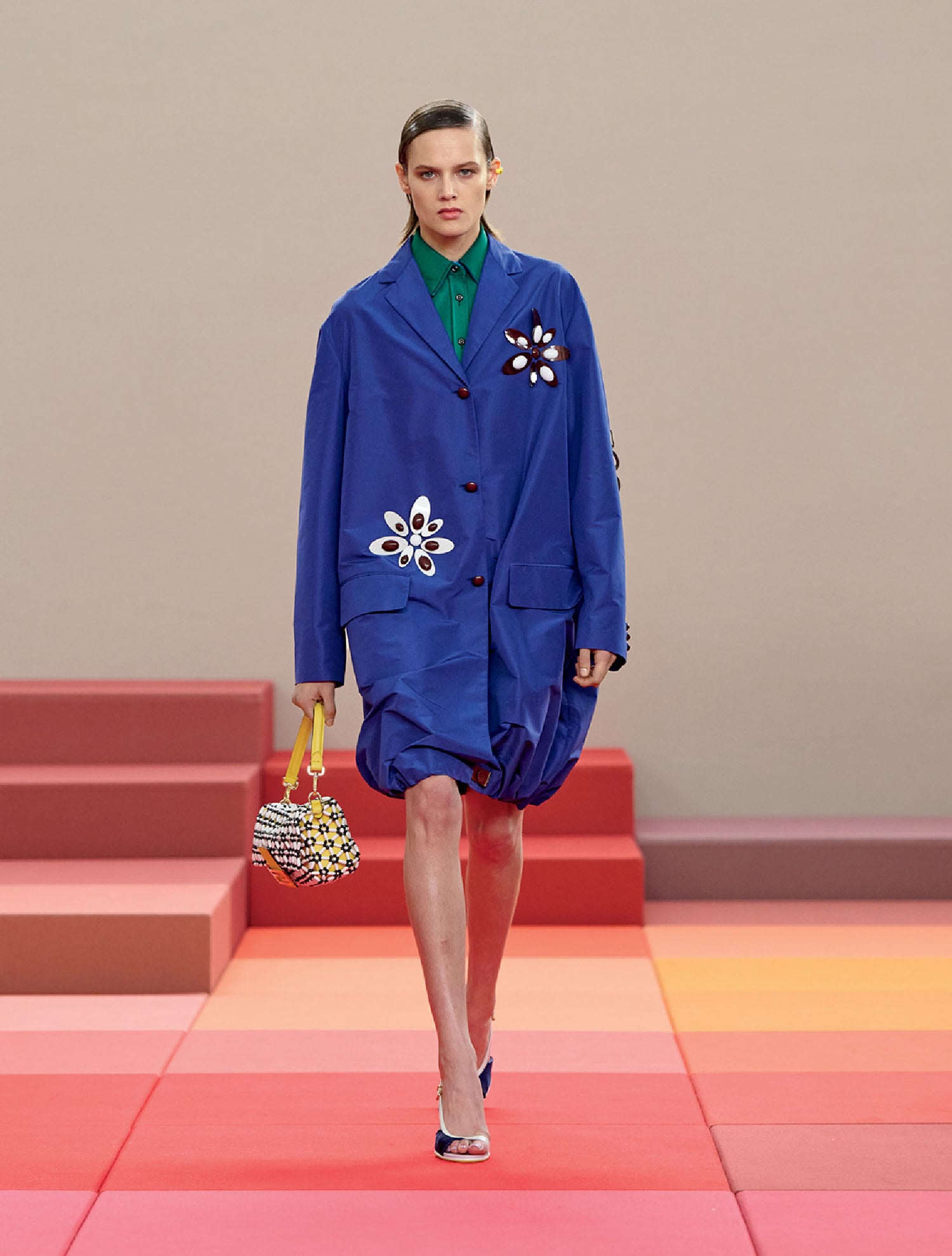 A model walks the runway at the louis vu show.