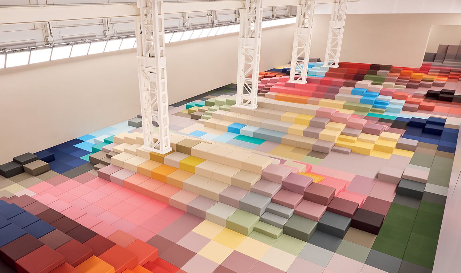 A large room with a large amount of colorful tiles.
