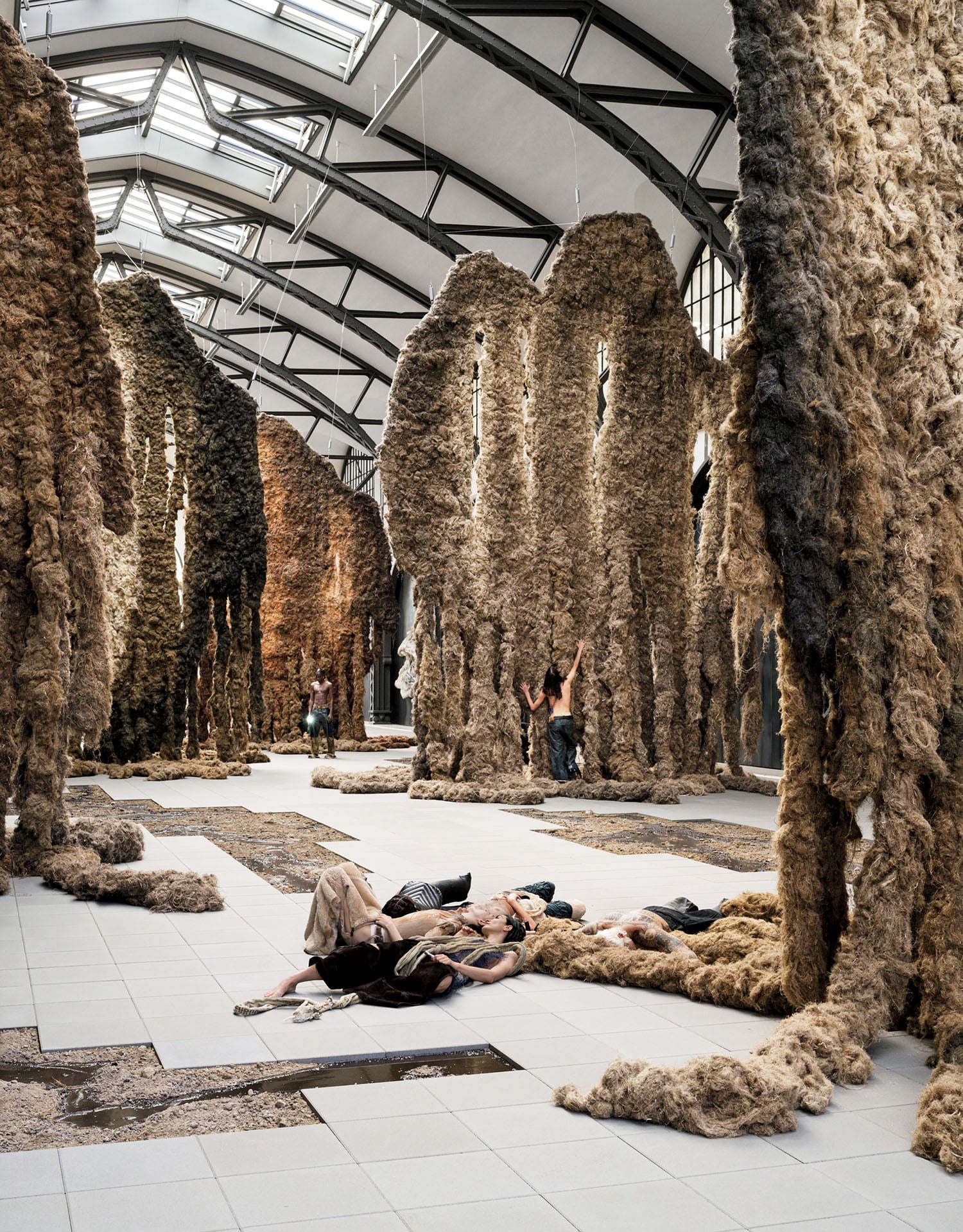 A woman laying on the ground in a room.