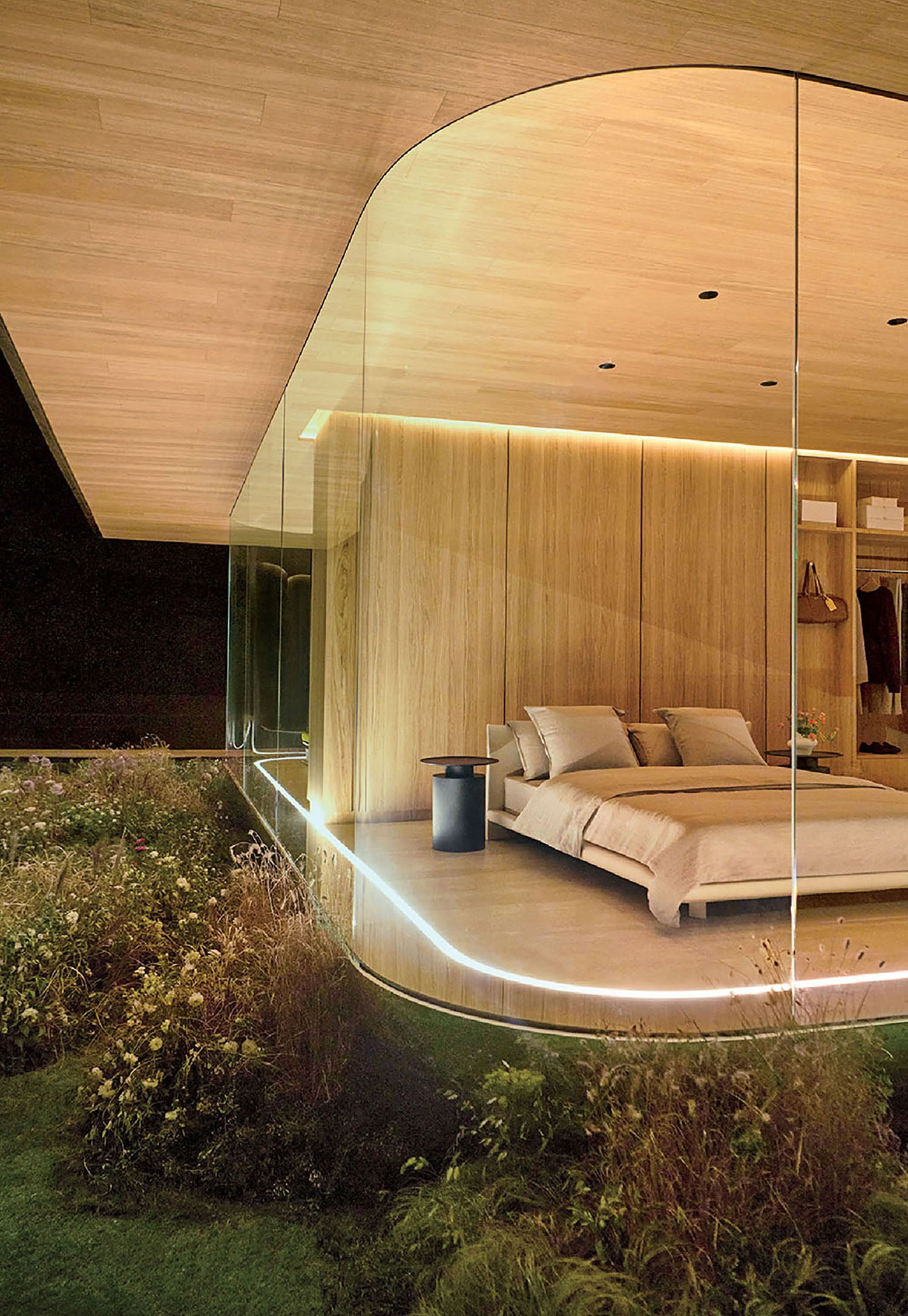 A bedroom with a bed and a mirror.