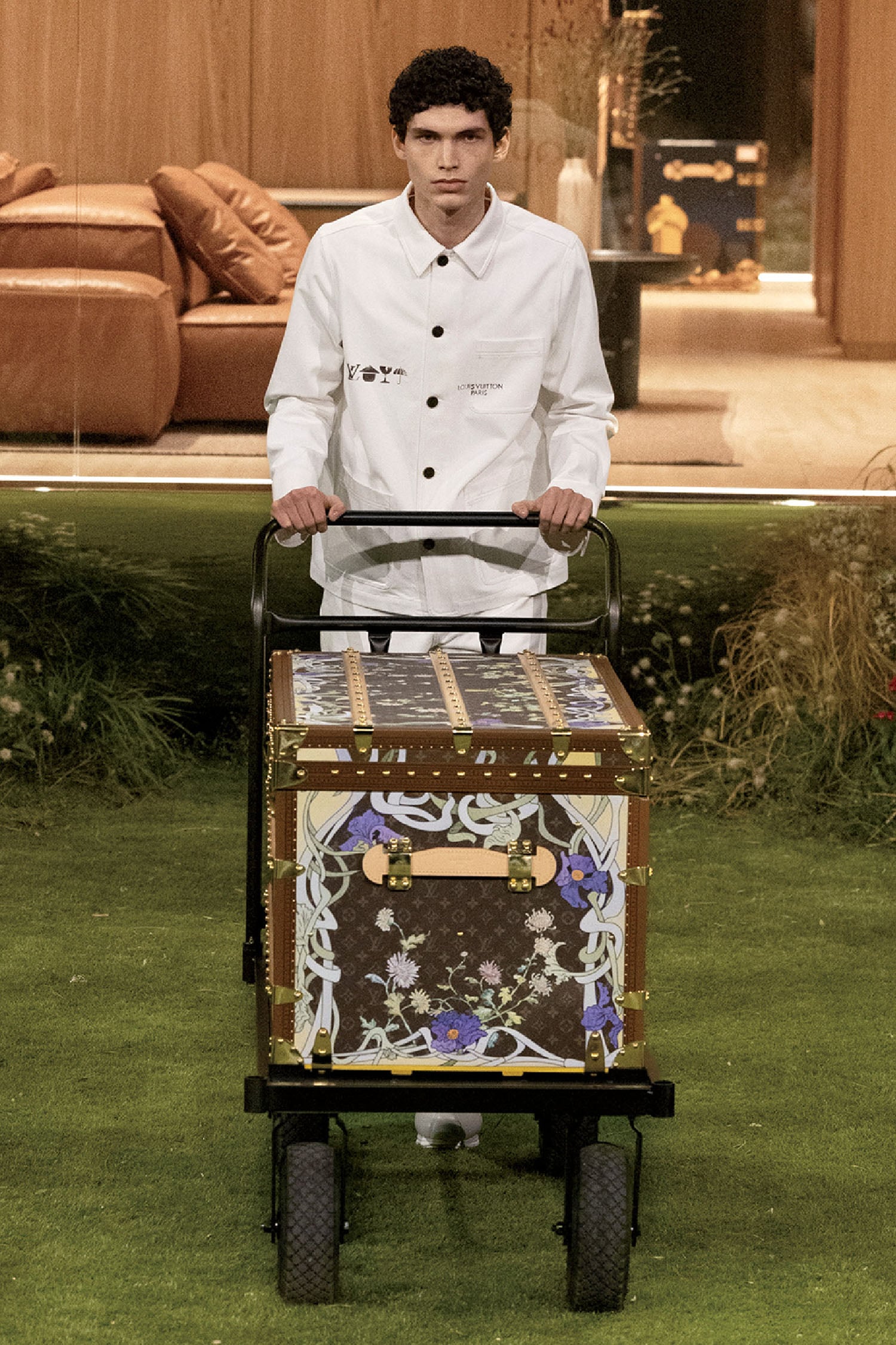 A man in a white shirt and a suitcase.