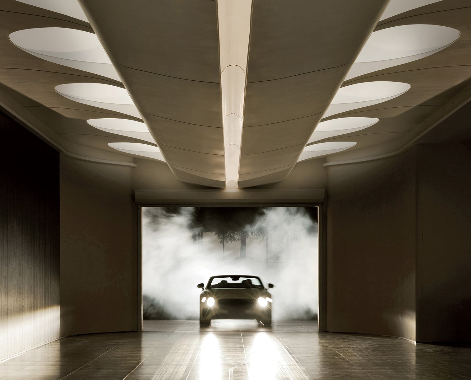 A car is parked in a dark room