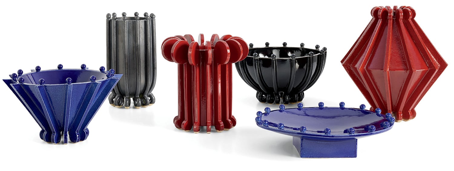 A group of different colored vases and vases