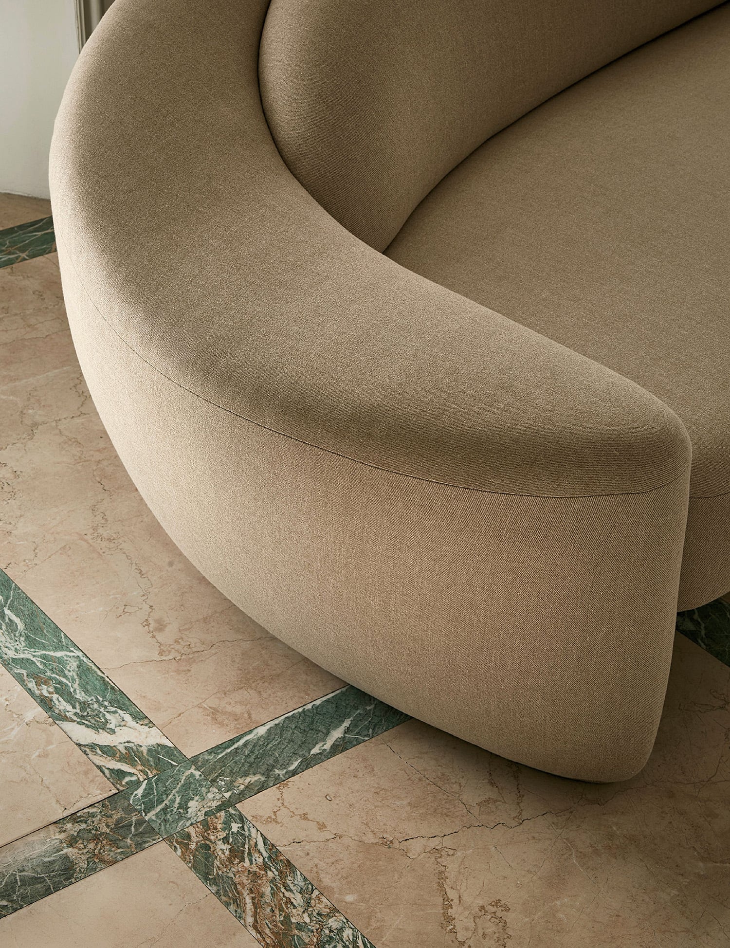 A couch sitting on a tiled floor
