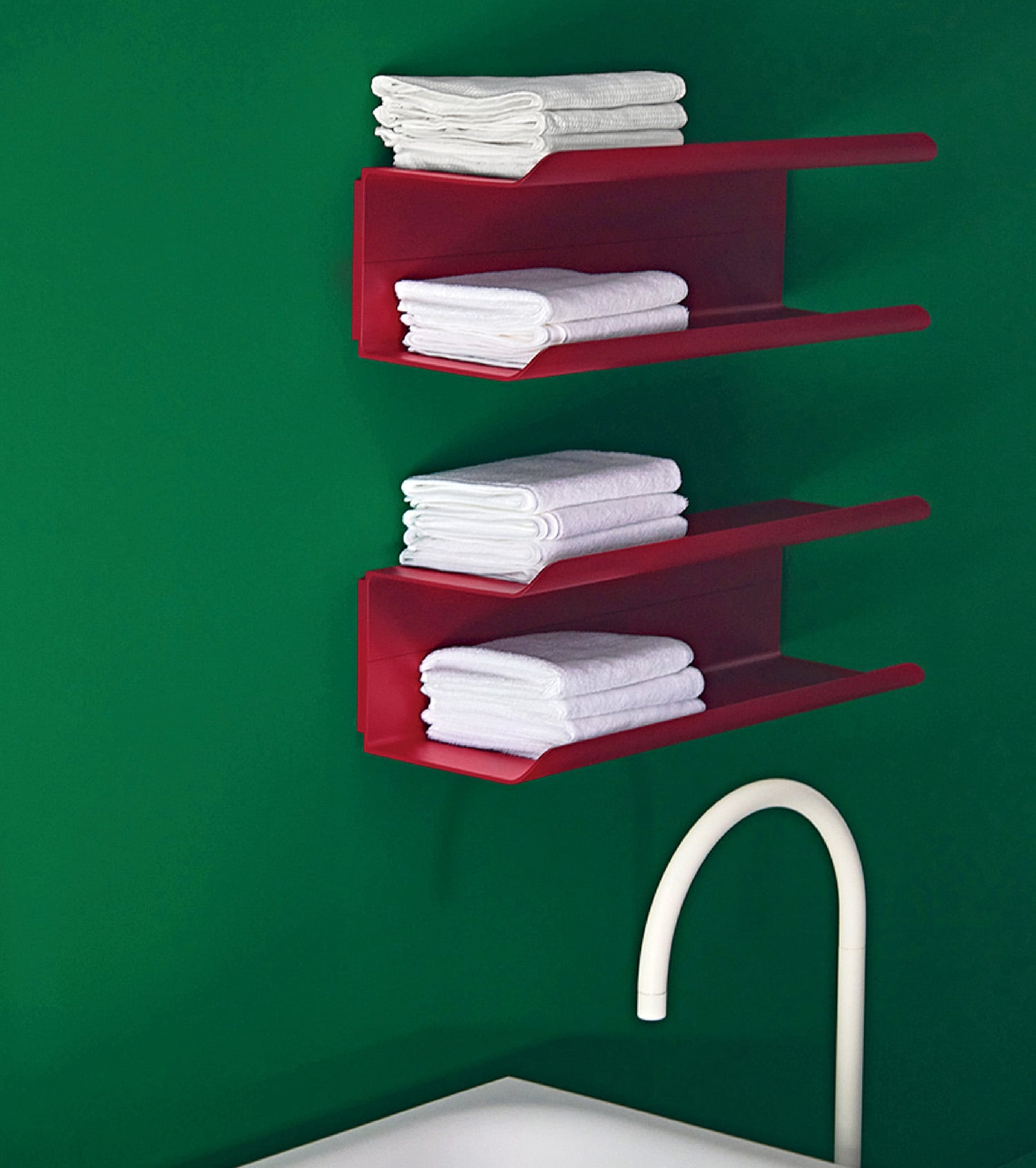 A bathroom with a red shelf and a white sink