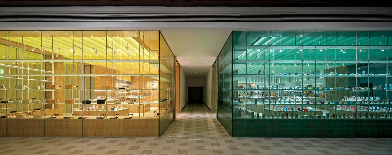 A store with a lot of bottles in the window.