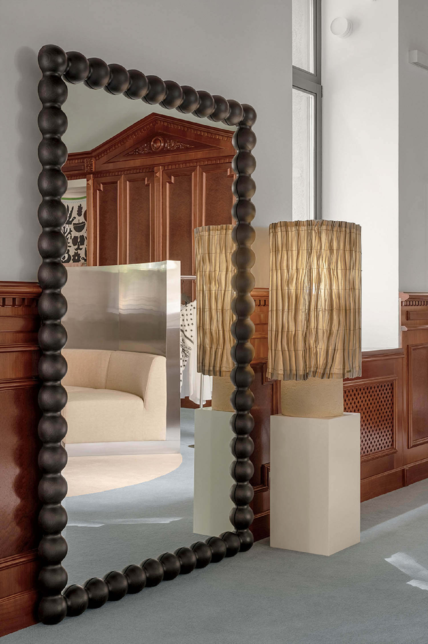 A mirror with a bunch of balls on it.