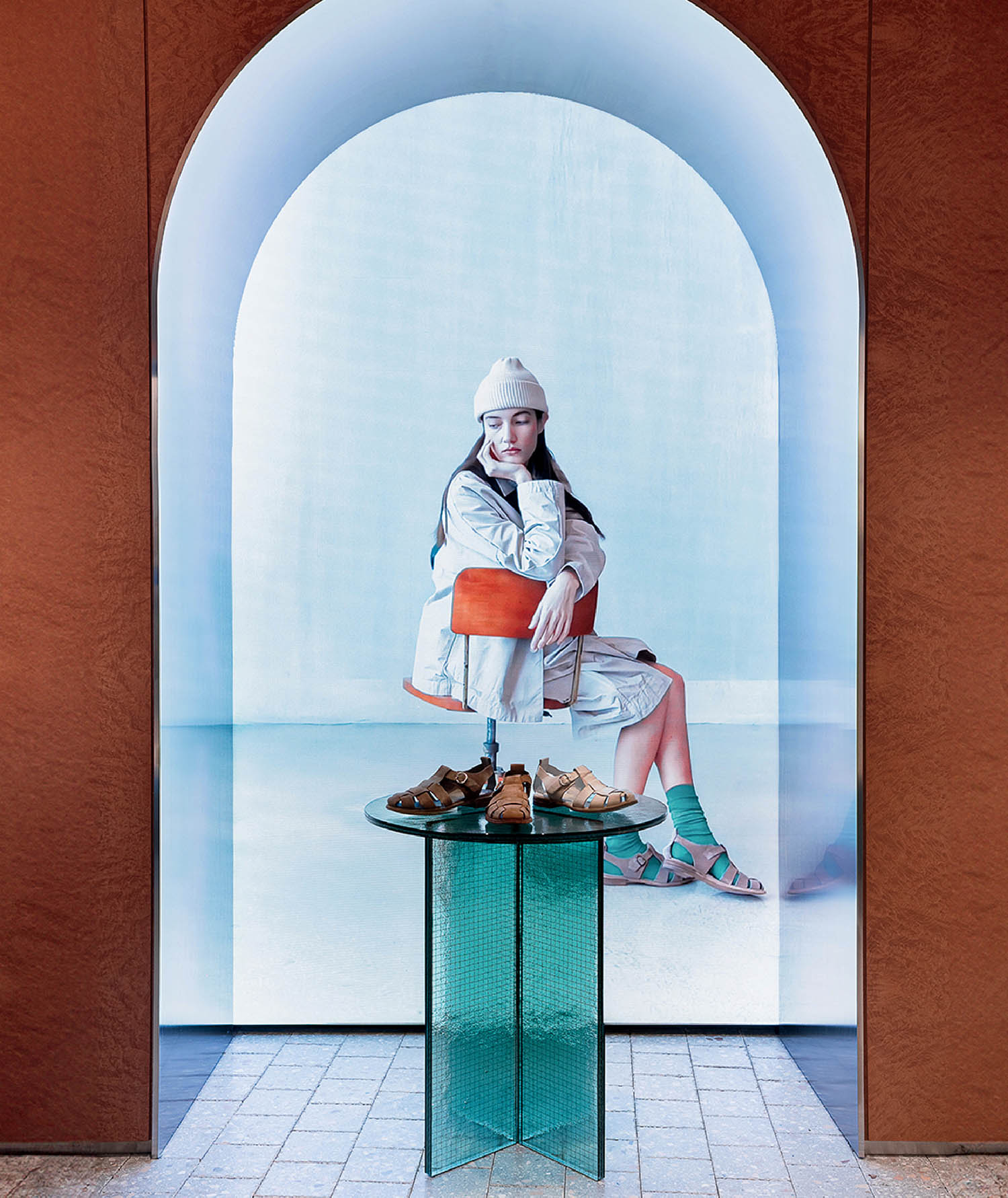 A woman sitting on a table with a sandals