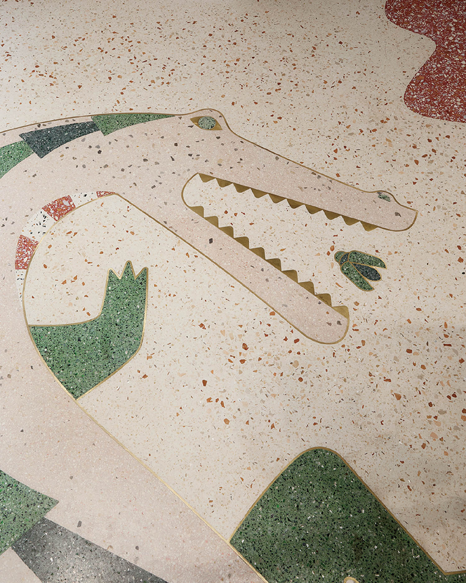 A skateboarder is riding down a sidewalk.