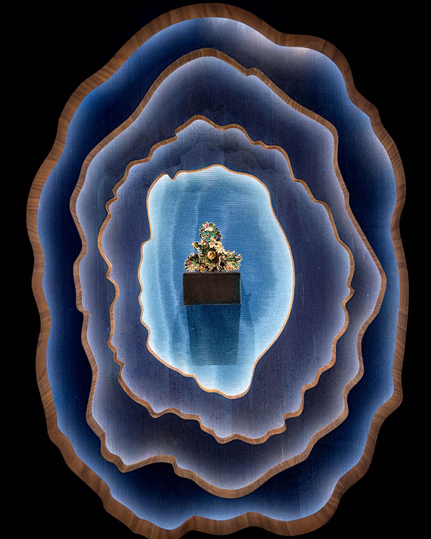 A man in a boat floating in a lake.