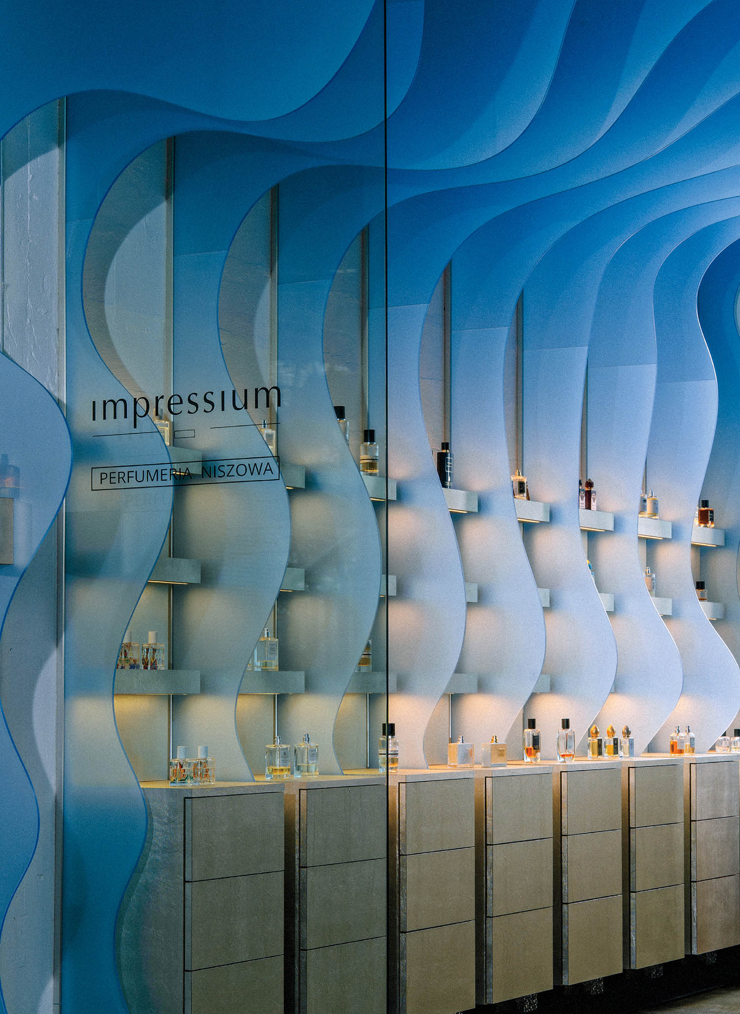 A bathroom with a large mirror and a sink.