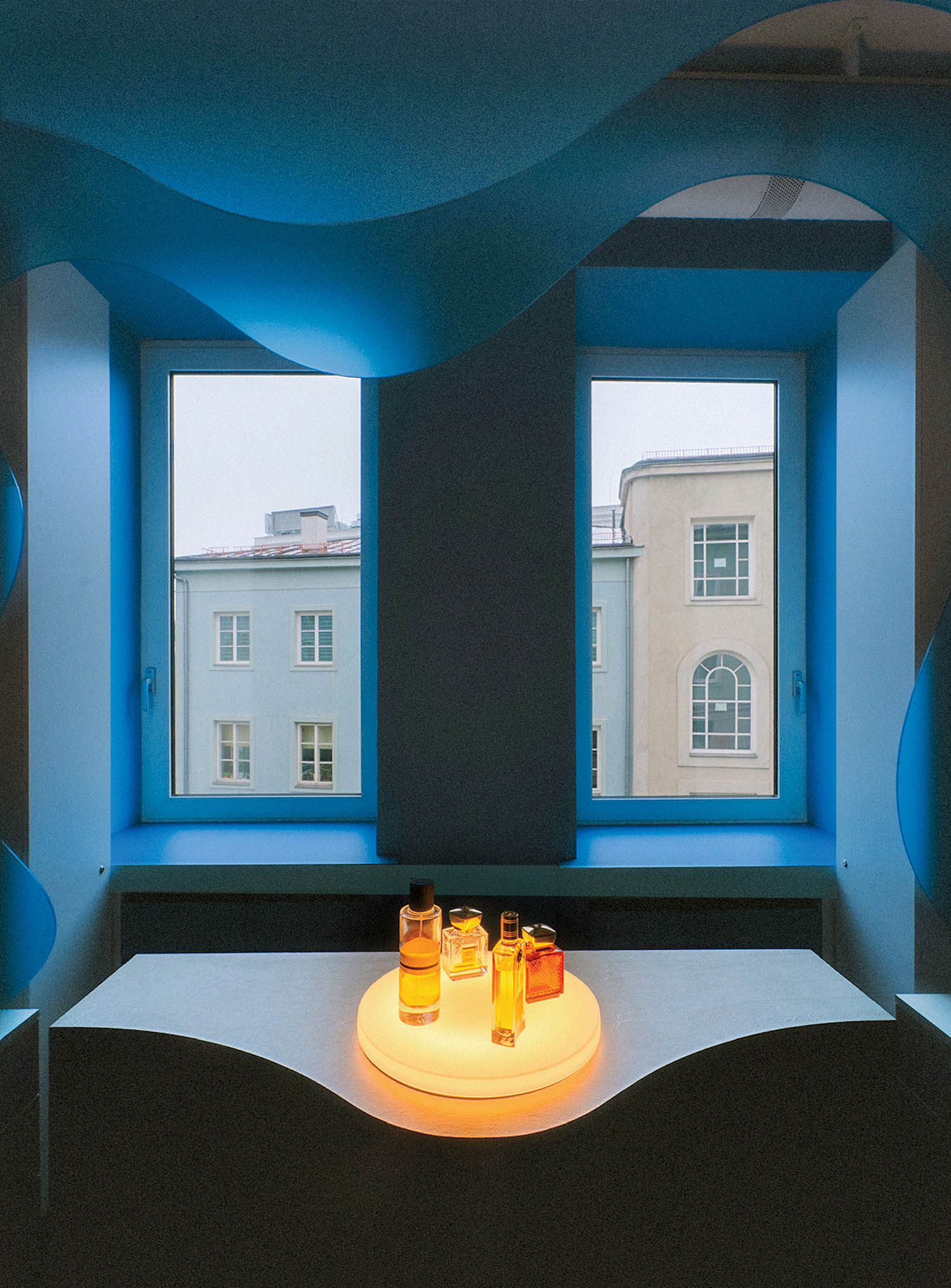 A room with a table and a window.