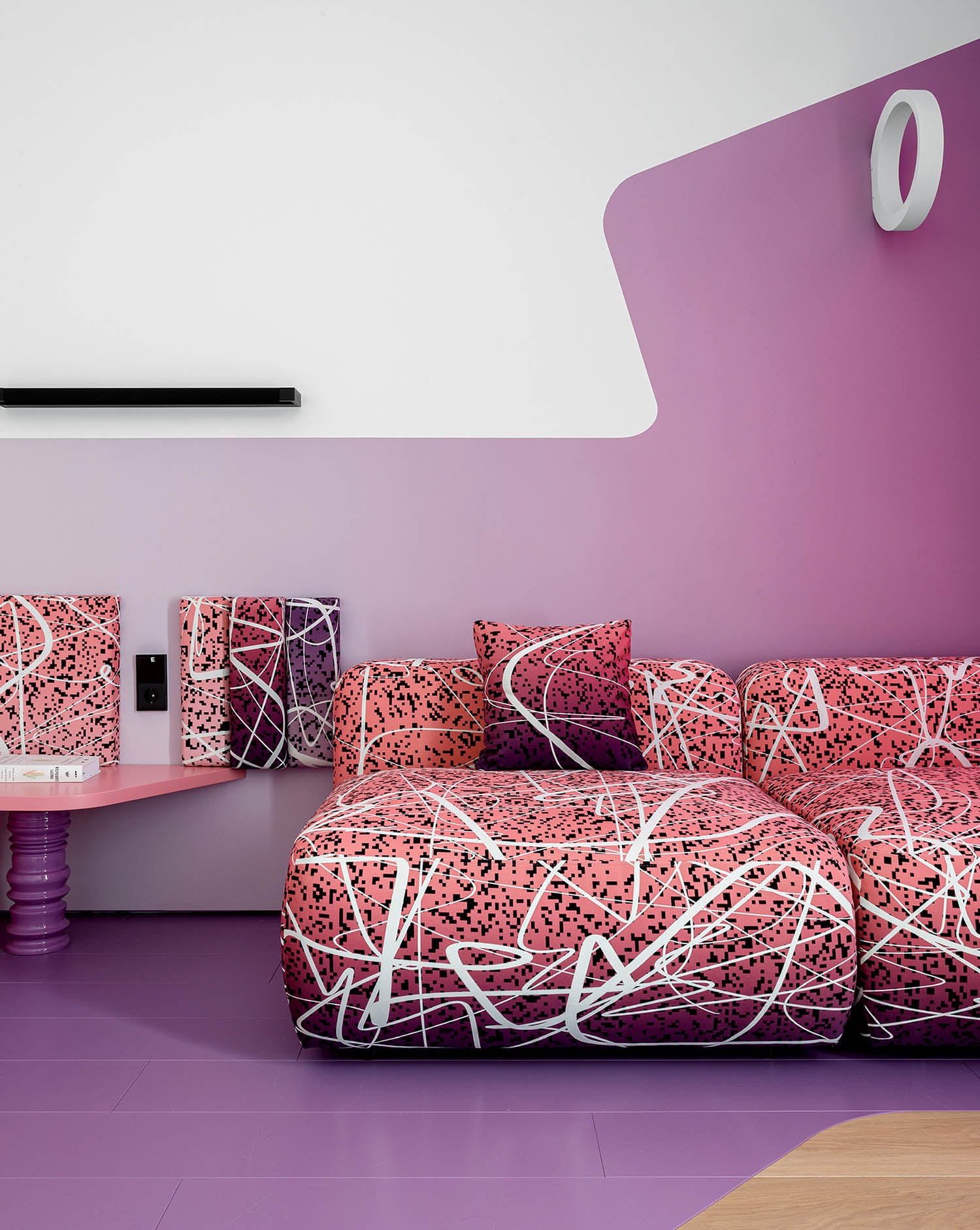 A living room with a couch and a table.