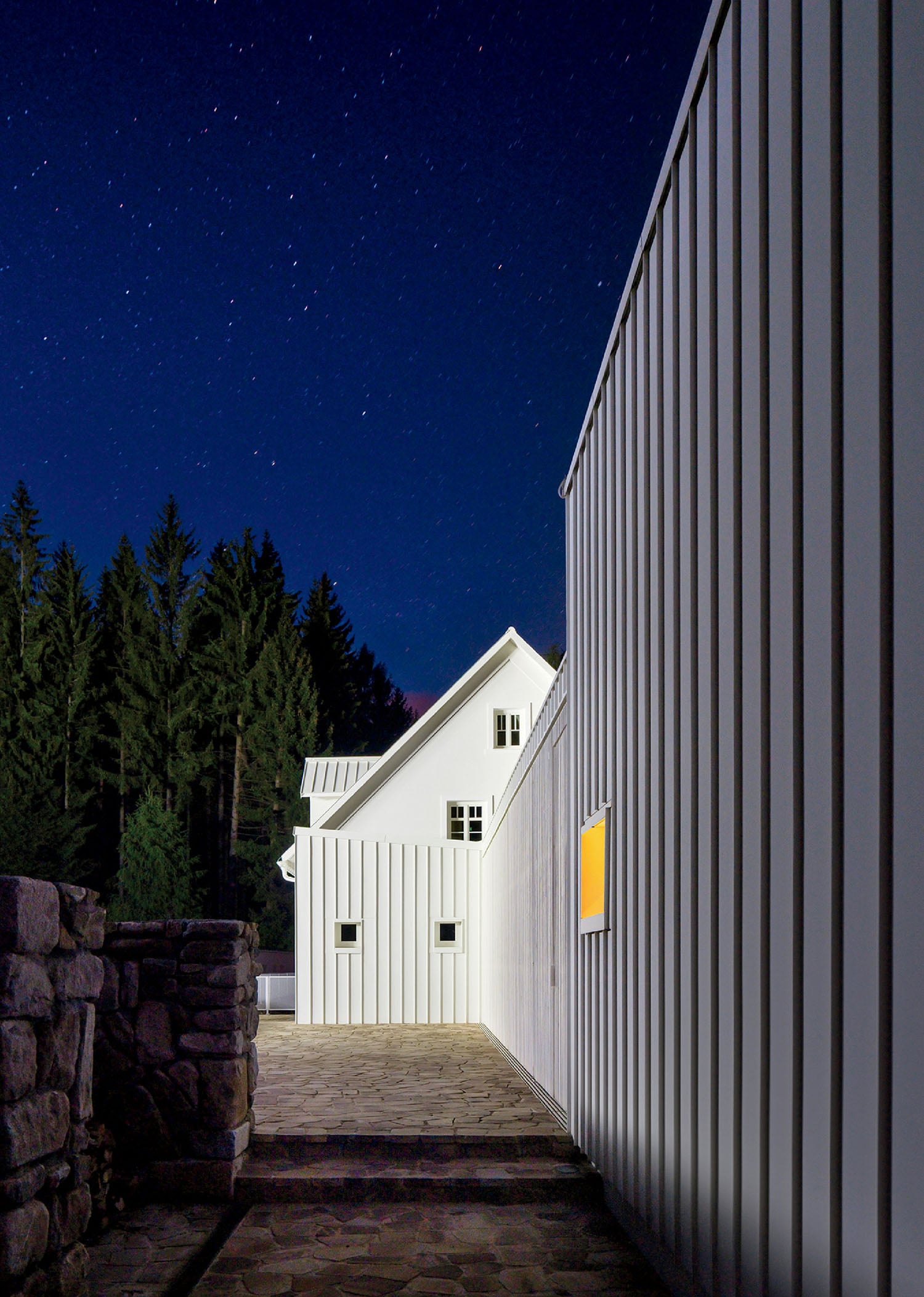A white building with a yellow door.