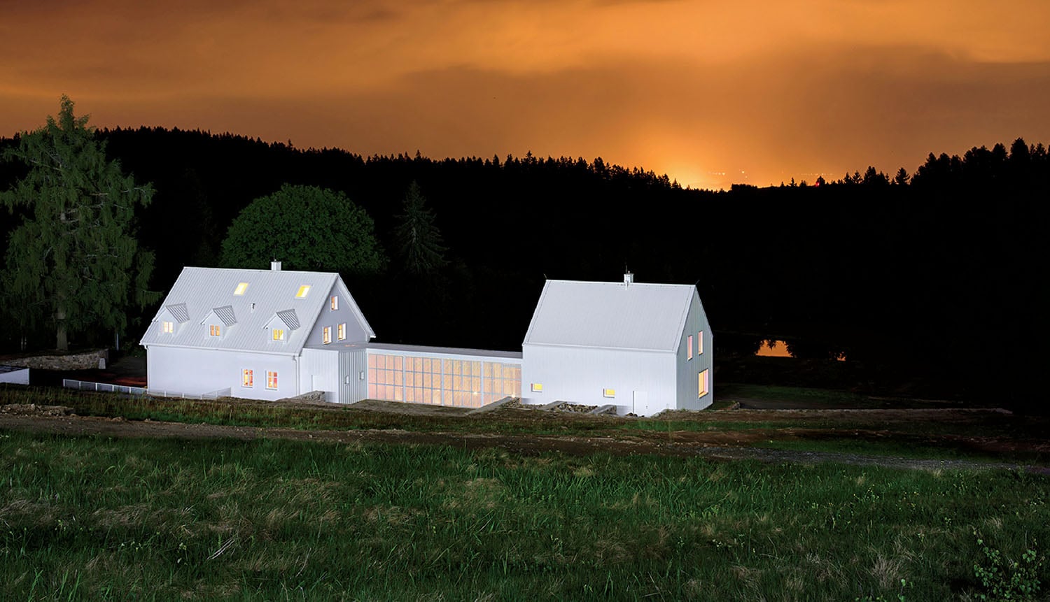 A house in the middle of a field.