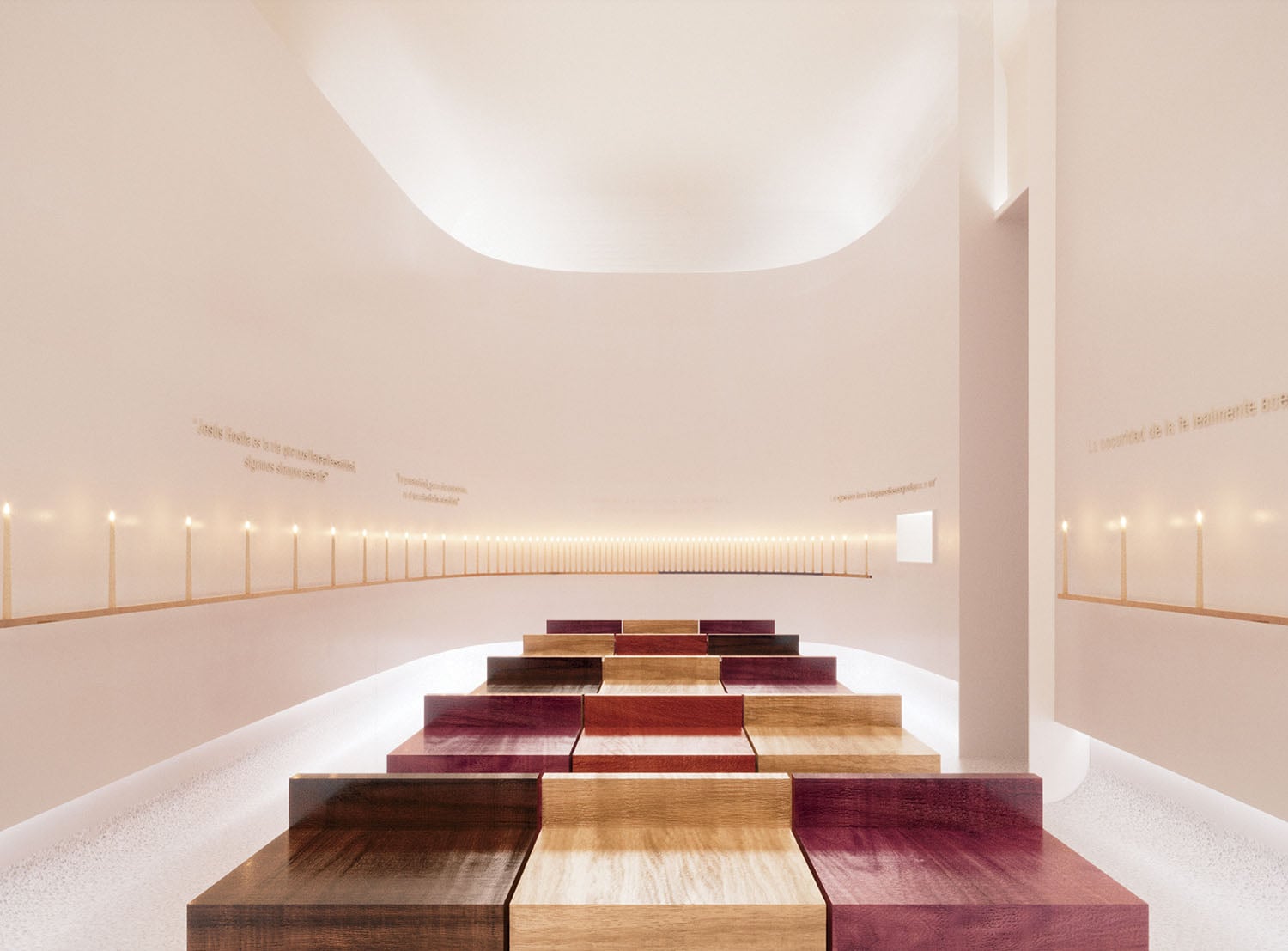 Minimalist interior with rows of colorful wooden benches facing a curved white wall lined with evenly spaced candles and gold text.