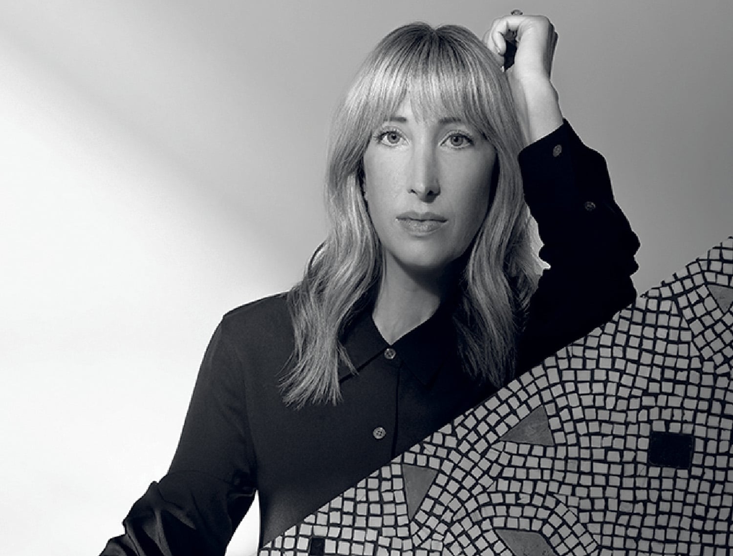 A woman holding a large umbrella