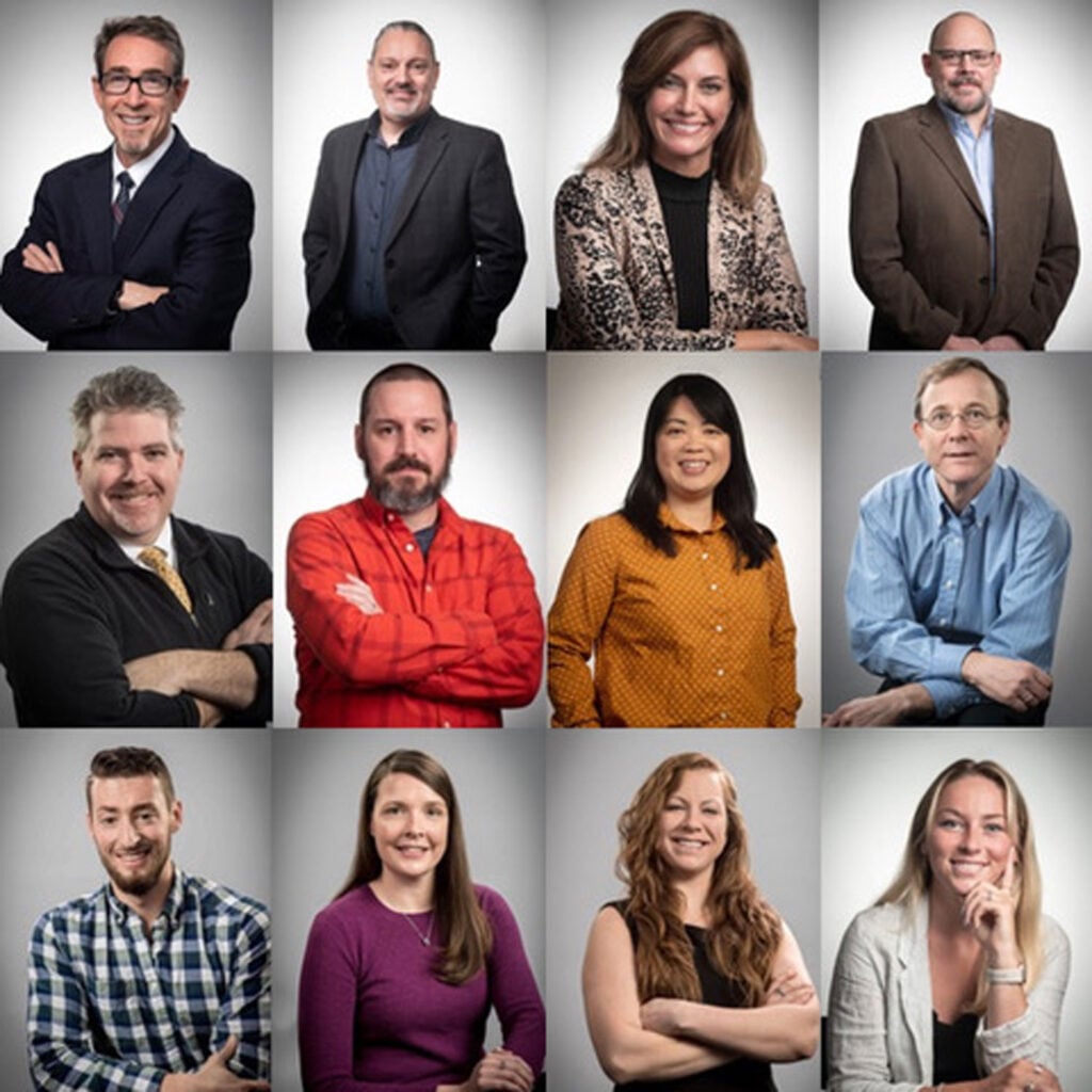 A grid of twelve adults, each posing individually against a plain background, wearing business casual attire and smiling at the camera.