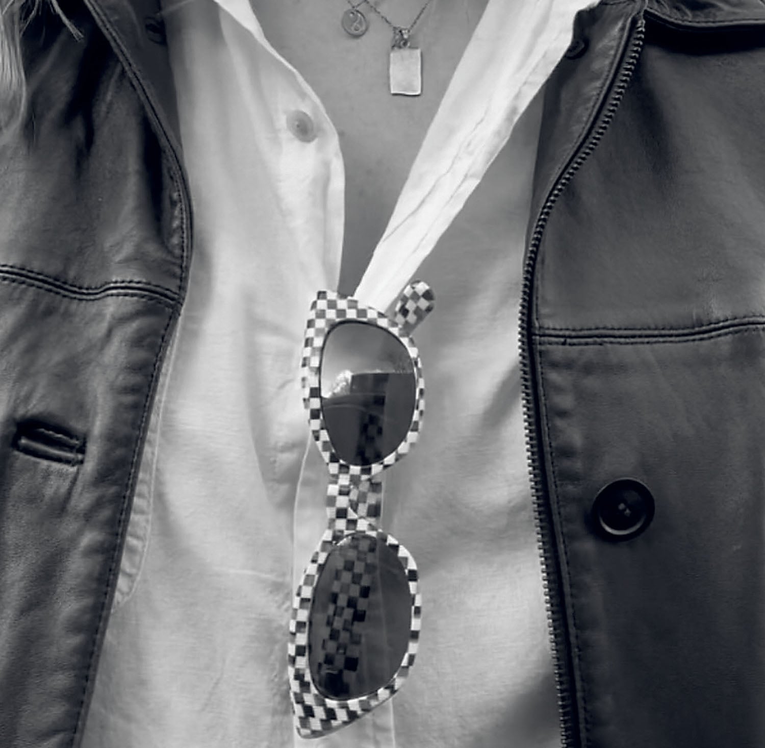 A woman wearing a black and white checkered shirt.
