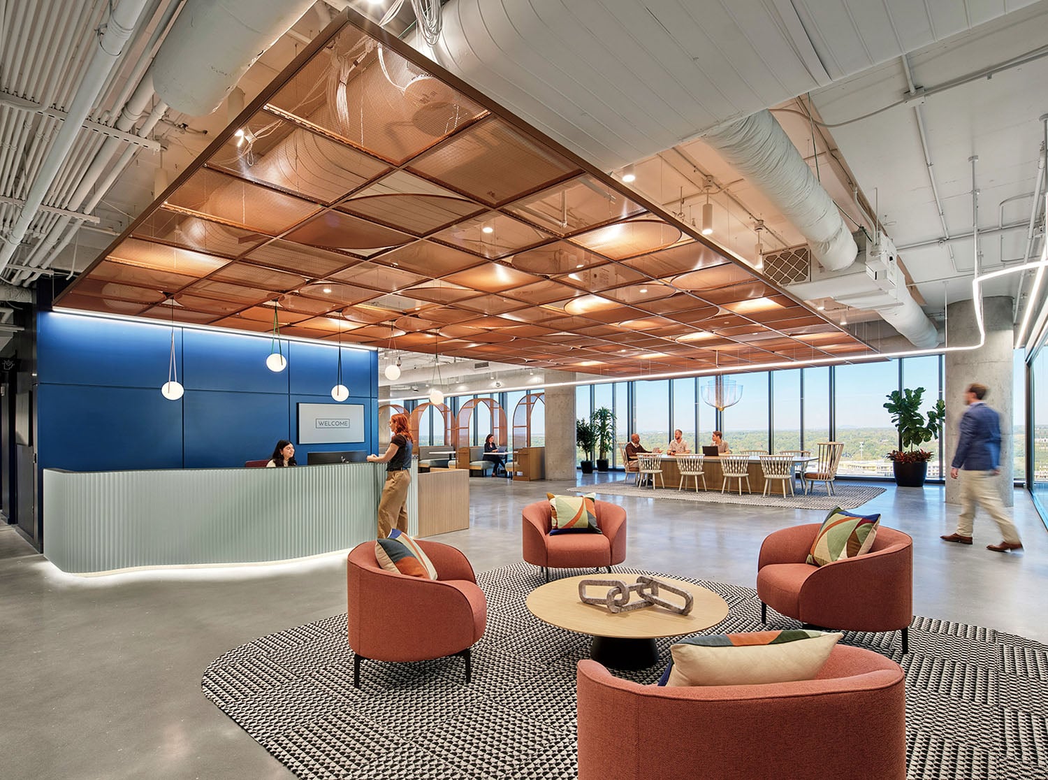 A large open space with a large desk and chairs.