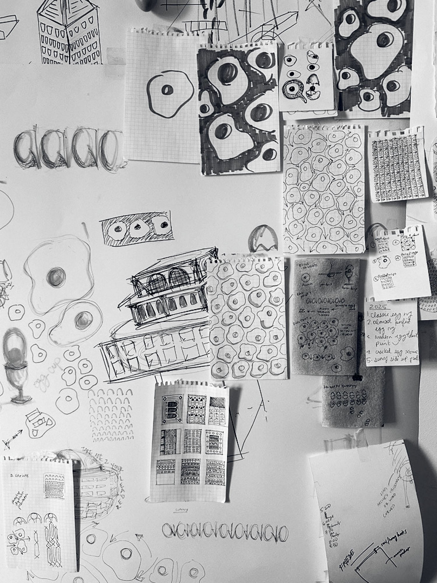 A bunch of drawings on a wall.