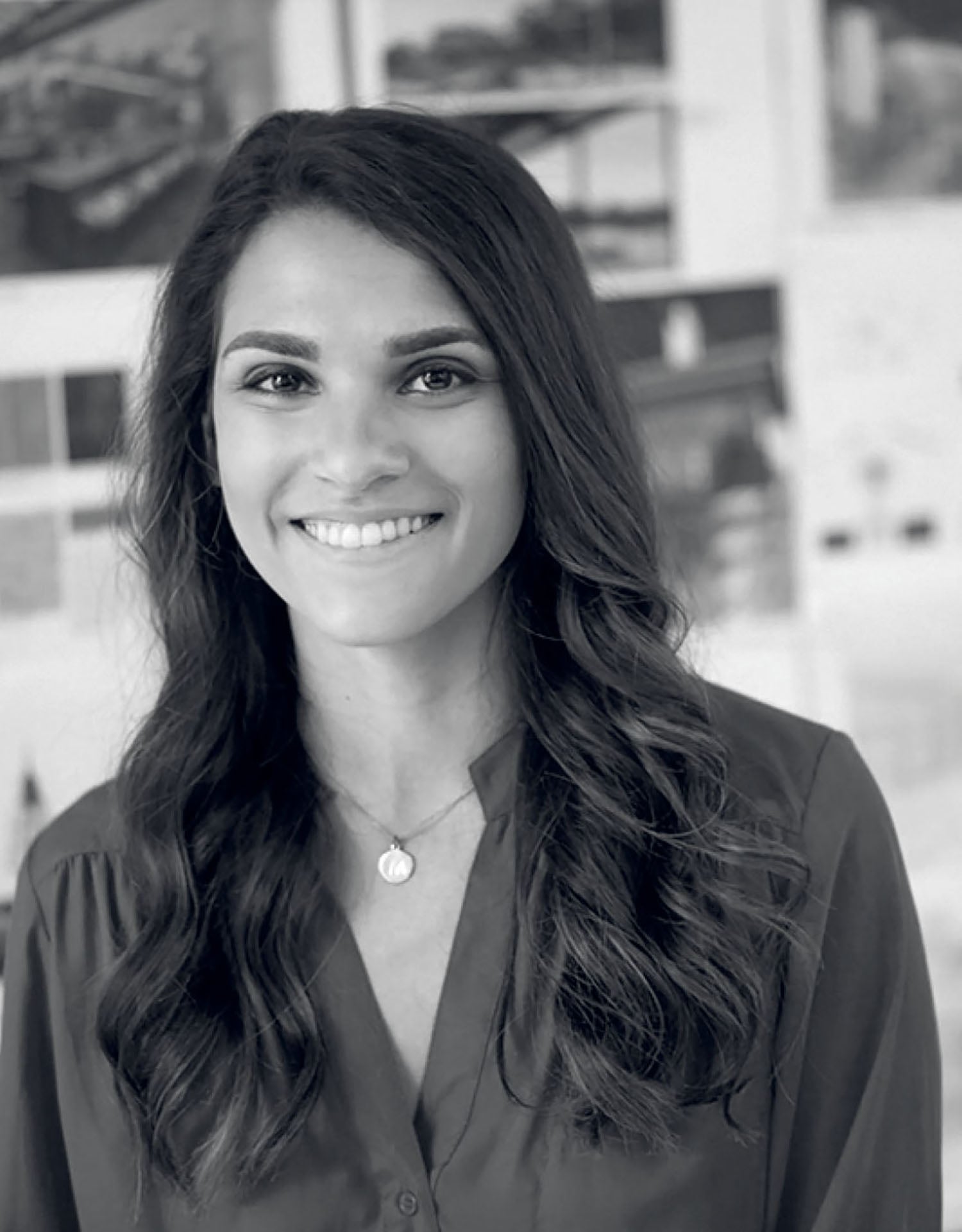 A woman in a black shirt and white background.