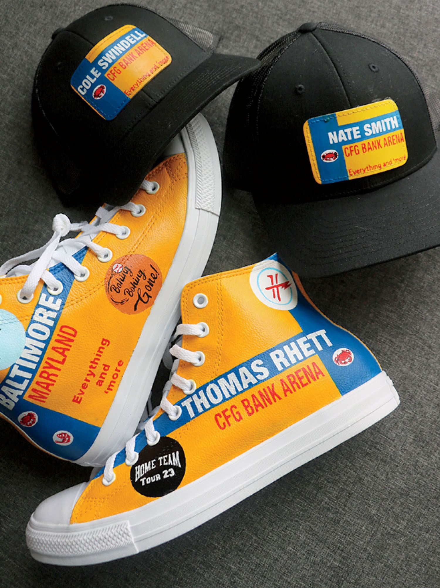 A pair of shoes and a hat on the floor.