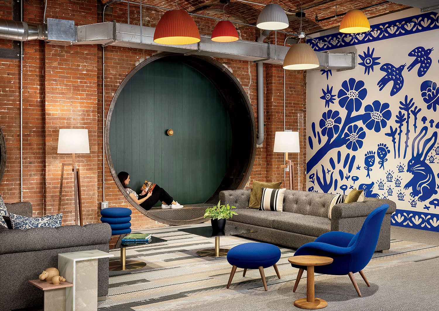 A living room with a large blue door.