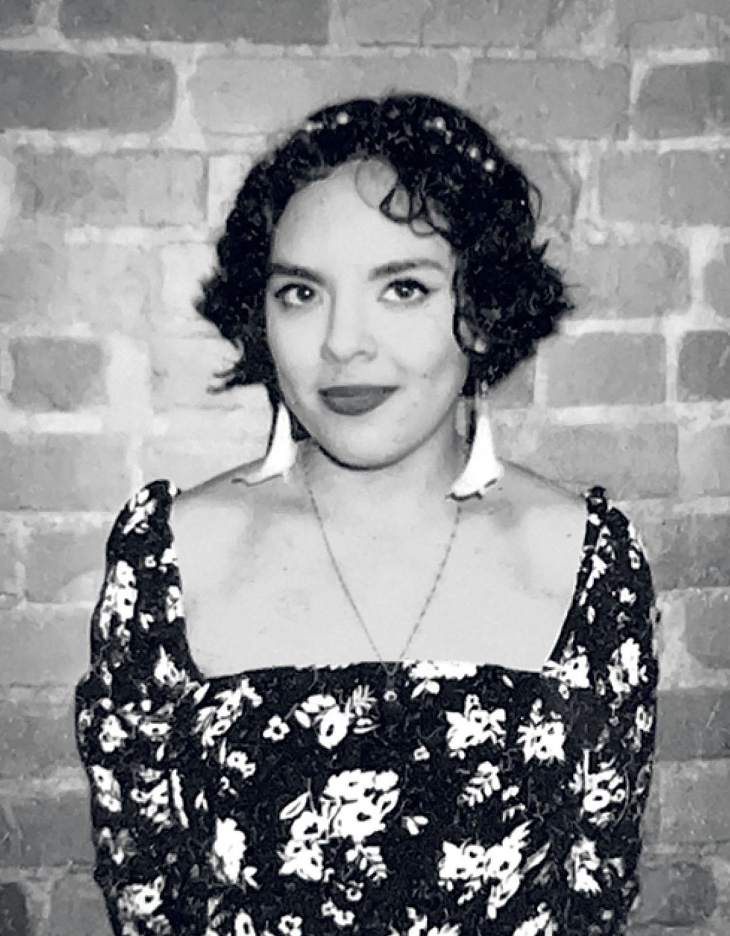 A woman in a black and white dress.