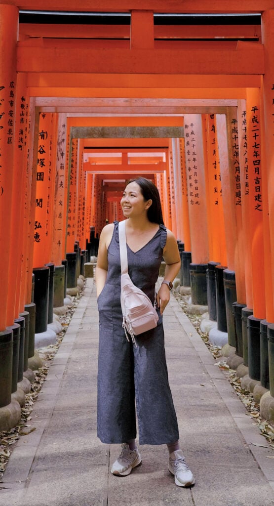 A woman standing in front of a torido.