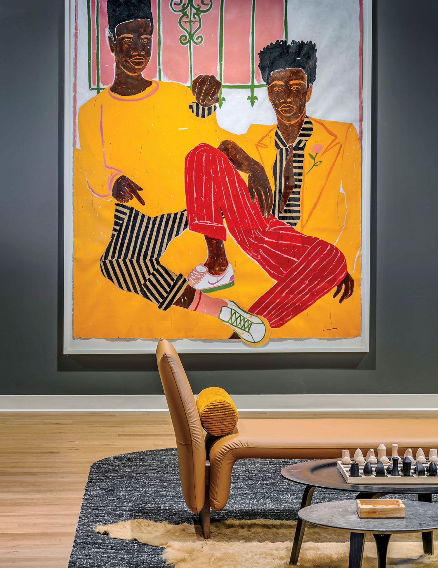 A painting of two men sitting on a couch.