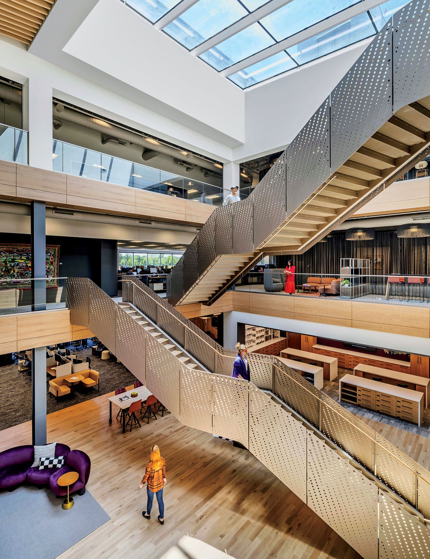 A large open space with a staircase and a skylight.