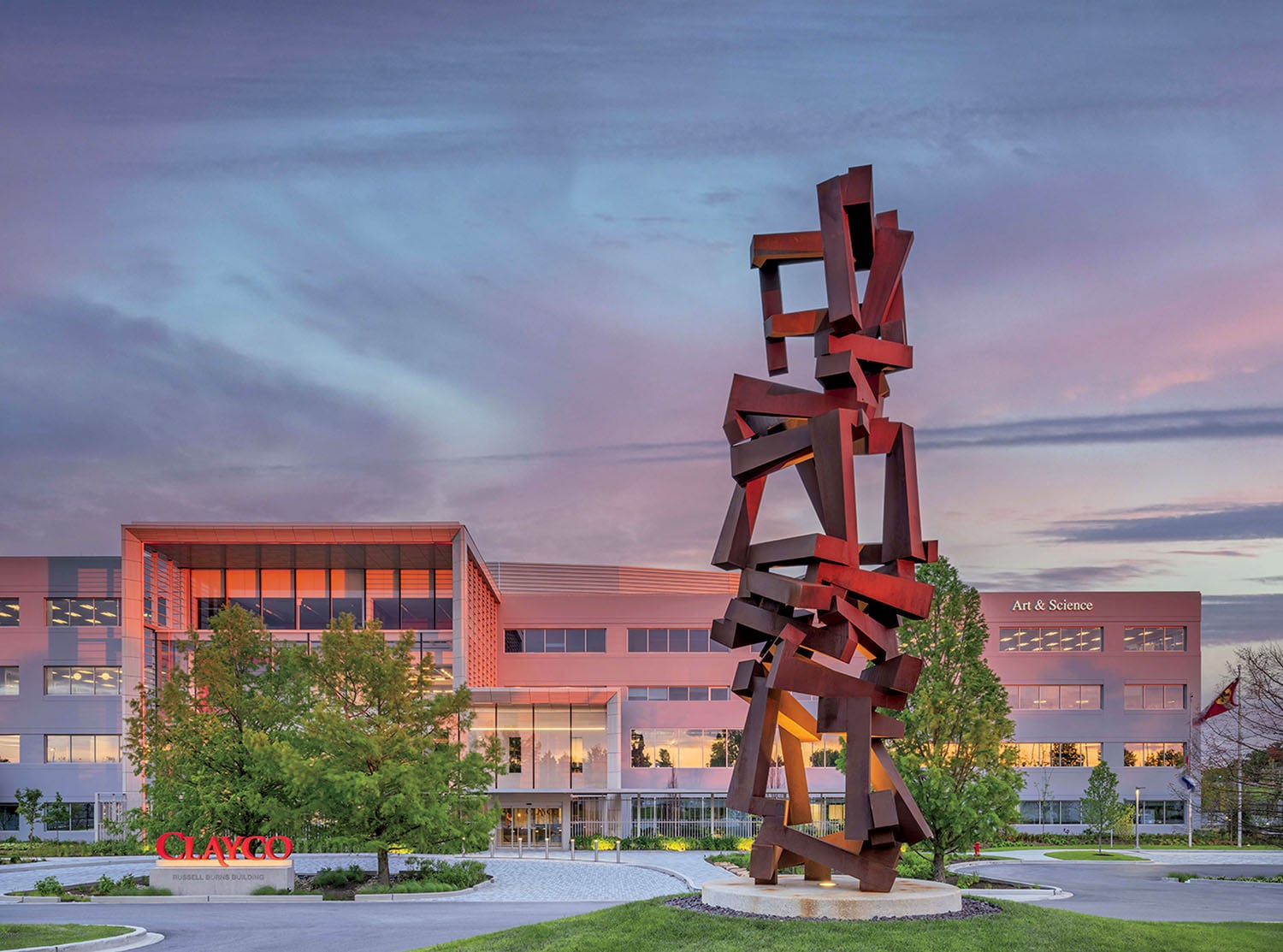 A large sculpture in front of a building.